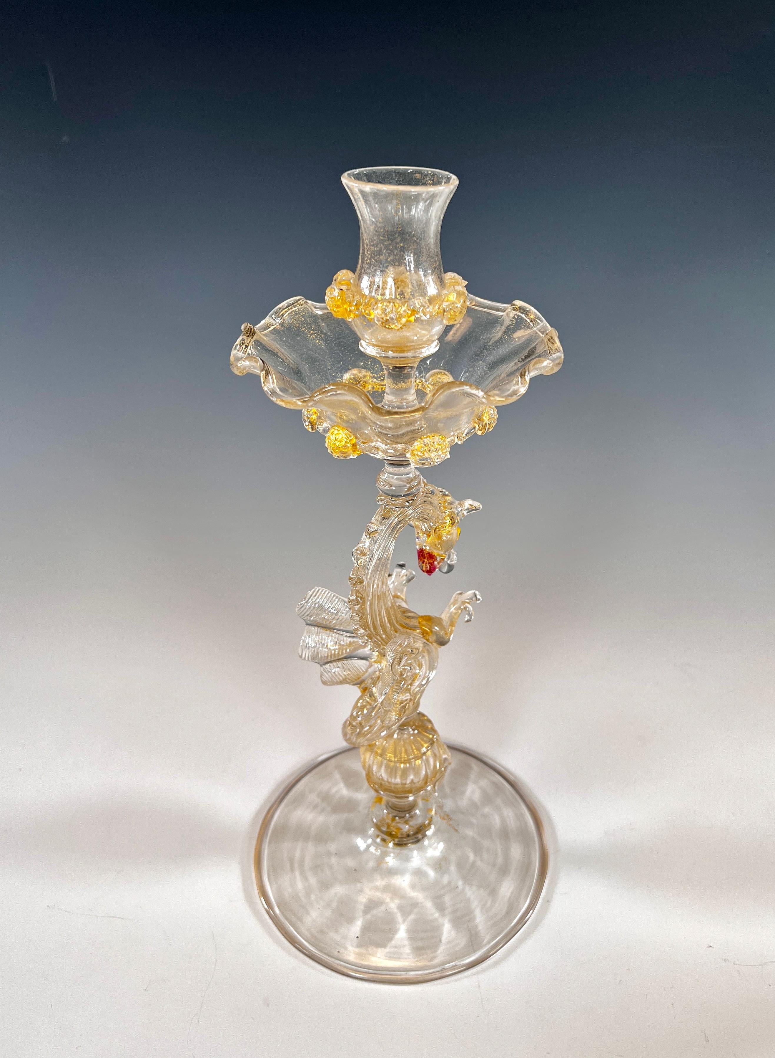 Dragon themed Venetian glass is one of the most sought after and rarest form of decoration and this pair of candlesticks exemplify that subject. Standing 9 1/2
