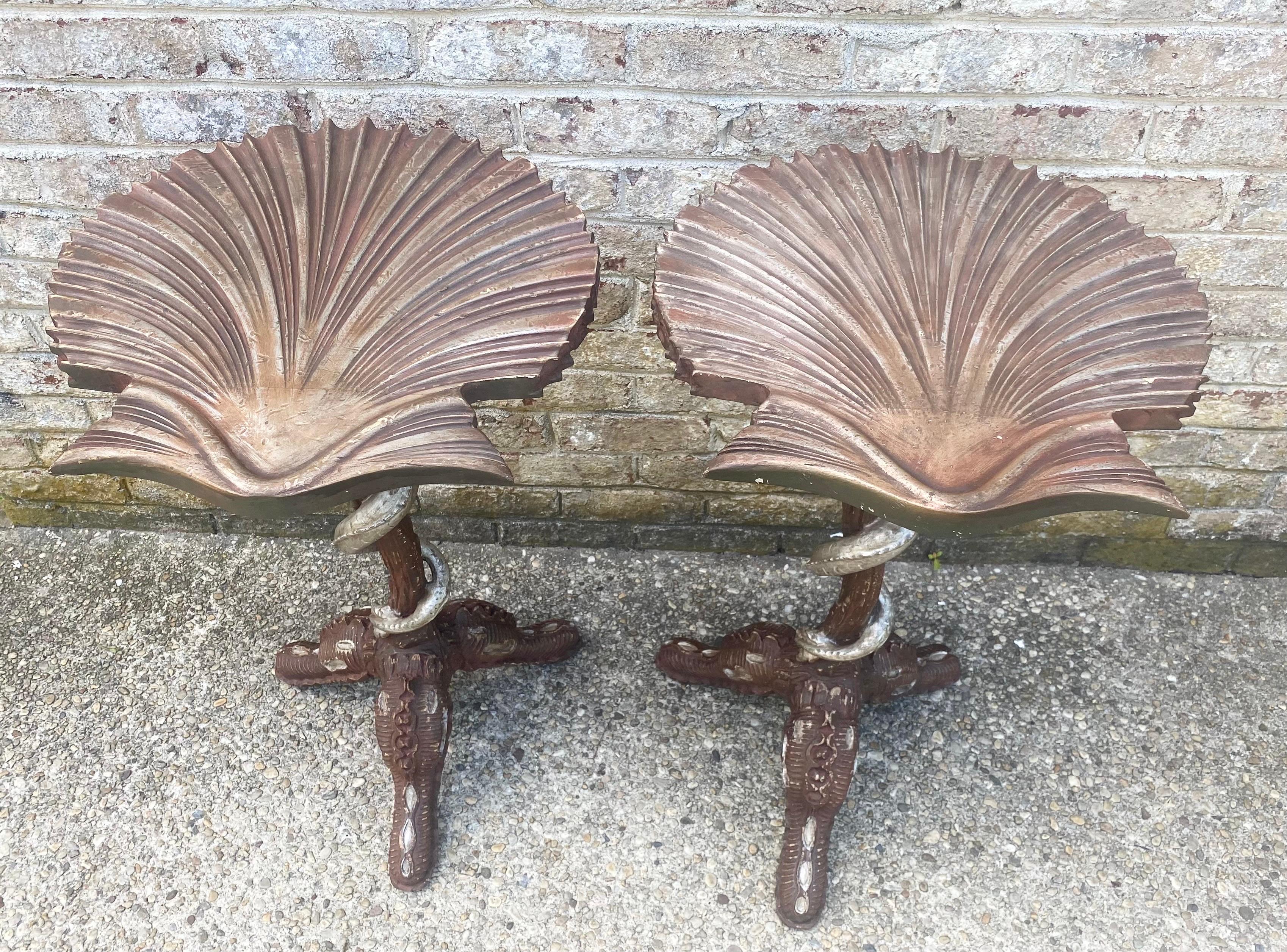 Unique and rare pair of Venetian style grotto chairs with tripod bases and carved silvered sea serpents twisting up the neck of the table. The tops are carved scallop shells.