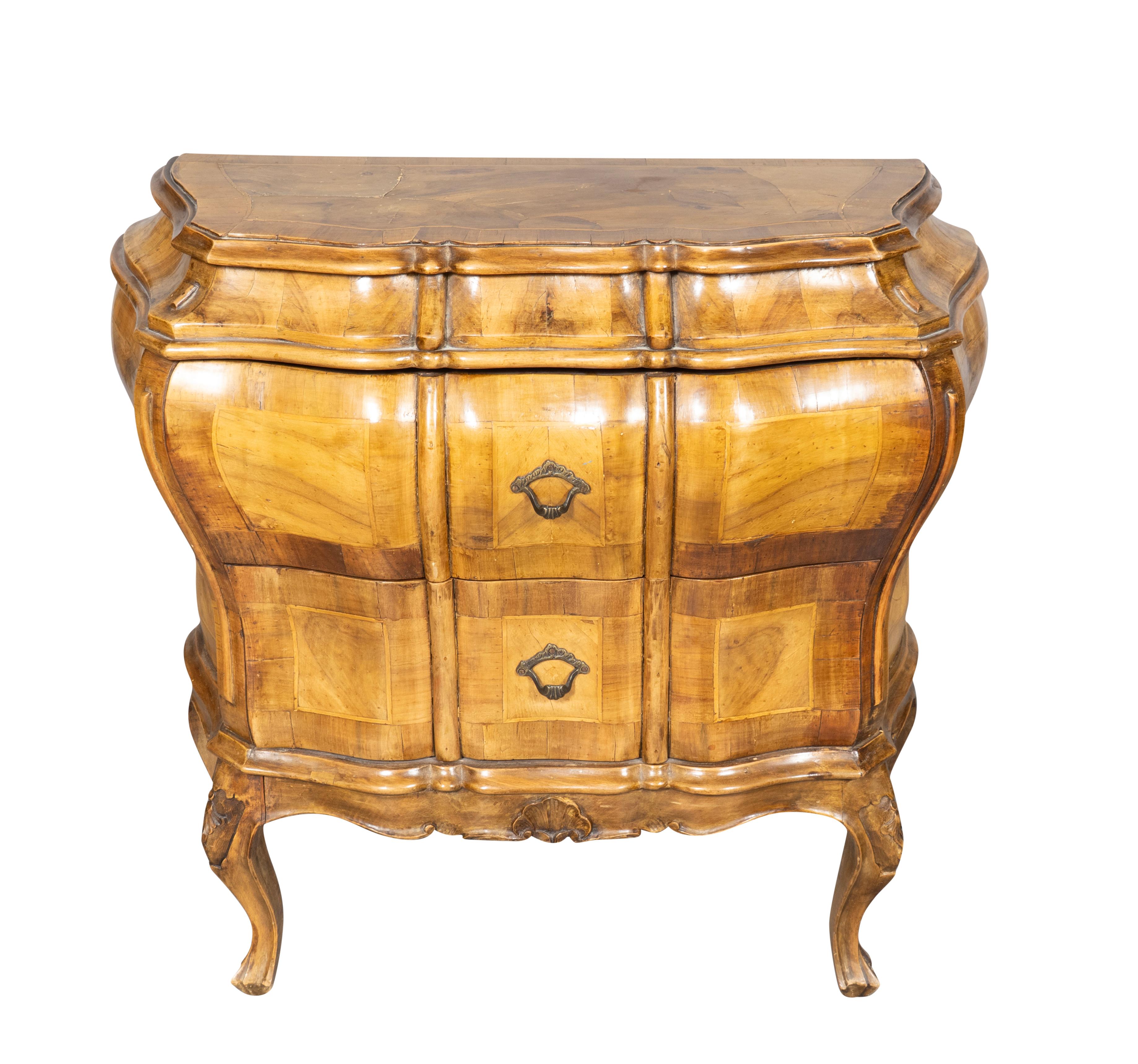 Each bombe form with two drawers with brass handles. Cabriole legs.