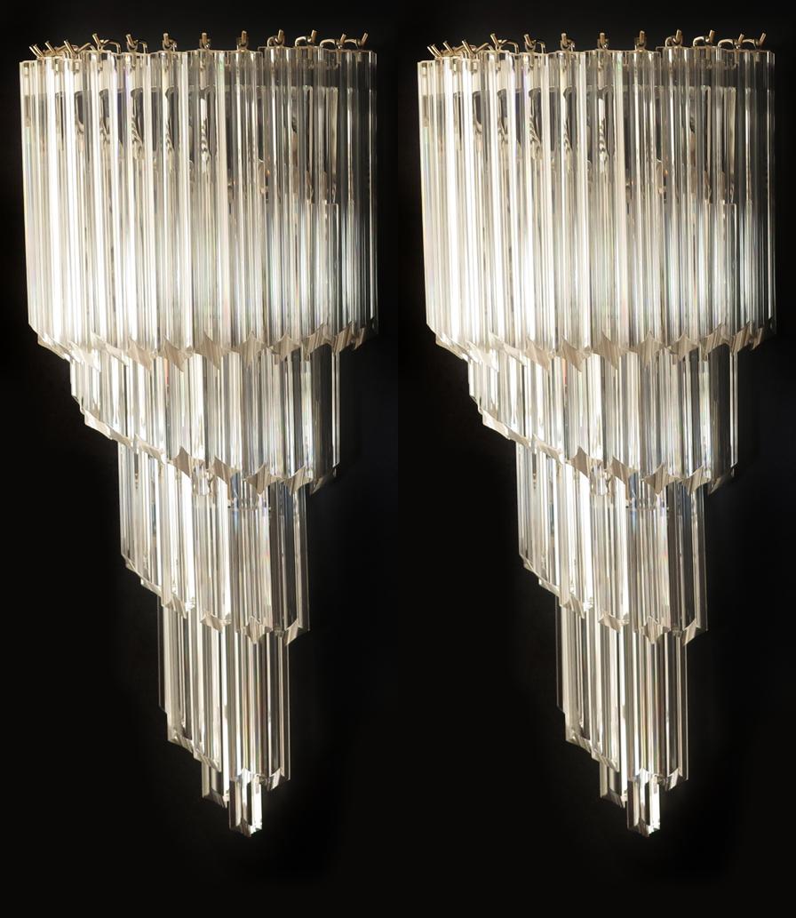 Fantastic pair of vintage Murano wall sconces made by 41 Murano crystal prism (quadriedri) for each sconce in a chrome metal frame. The shape of this sconce is spiral. The glasses are transparent.
Period: 1980s
Dimensions: 31.50 inches height (80