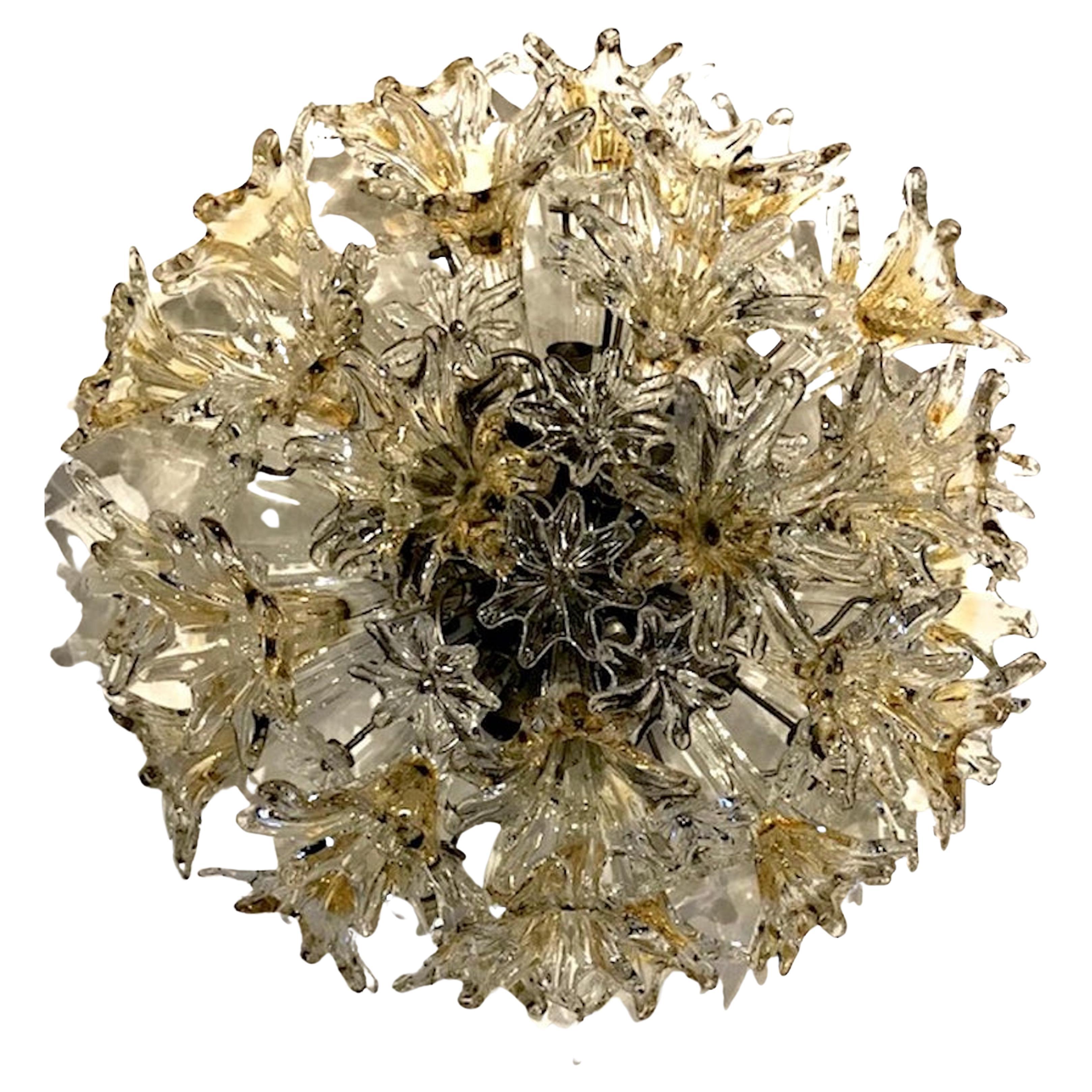Pair of designed by Toni Zuccheri for Venini is this Esprit ceiling mount light. Venini describes the model “Esprit” as an explosion of flowers and stars in hand blown, handcrafted glass. Designed to illuminate, shine, sparkle and excite, “Esprit”