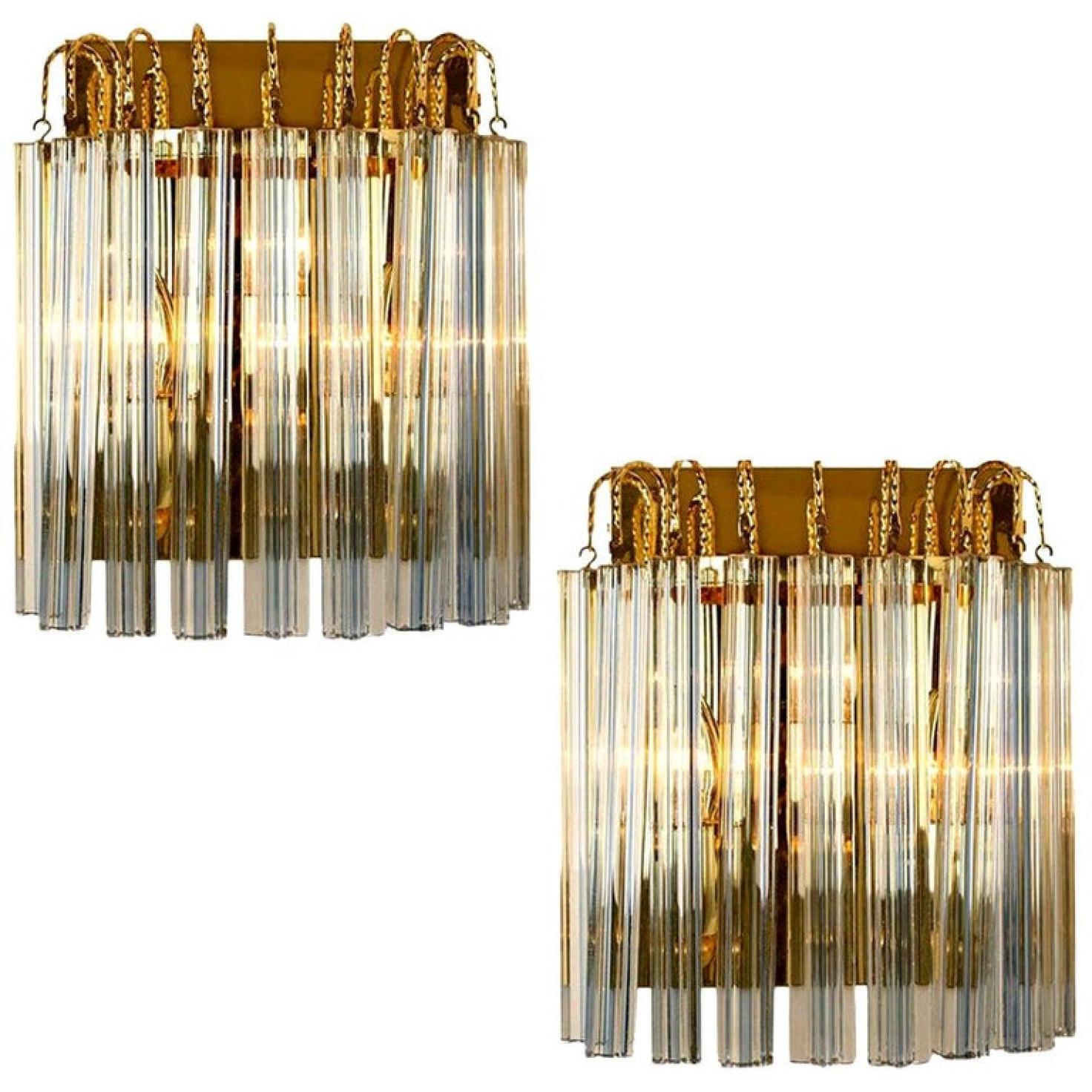Pair of Murano glass wall sconces featuring four crystal clear glass 