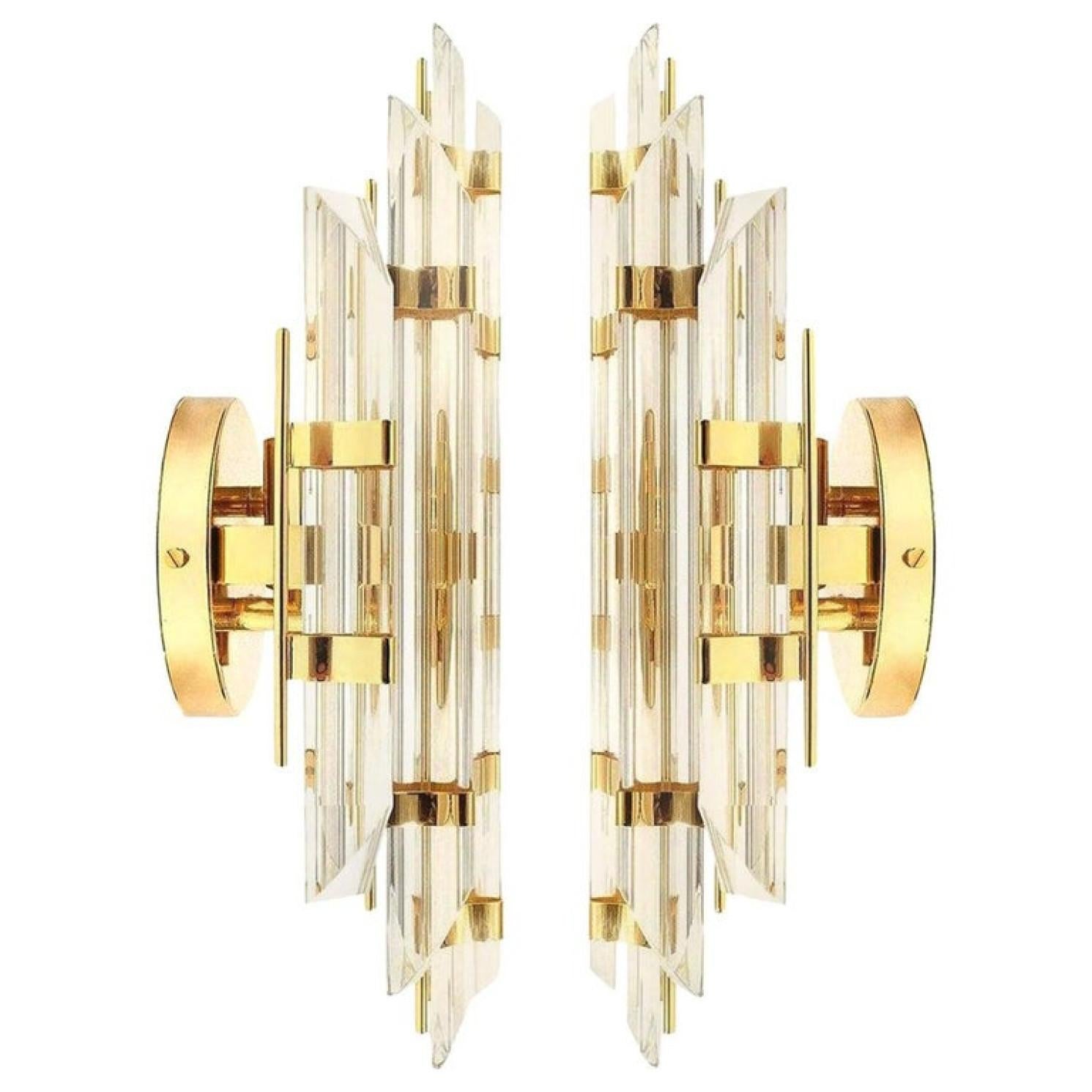 Pair of Murano glass wall sconces featuring five long crystal clear glass 