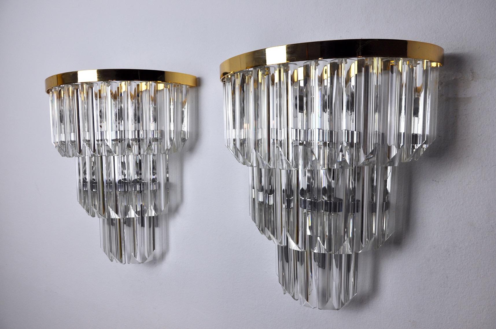 Superb large pair of venini sconces produced in italy in the 70s. Murano glass on 3 levels and gilded metal structure. Unique object that will illuminate wonderfully and bring a real design touch to your interior. Electricity checked, mark of time