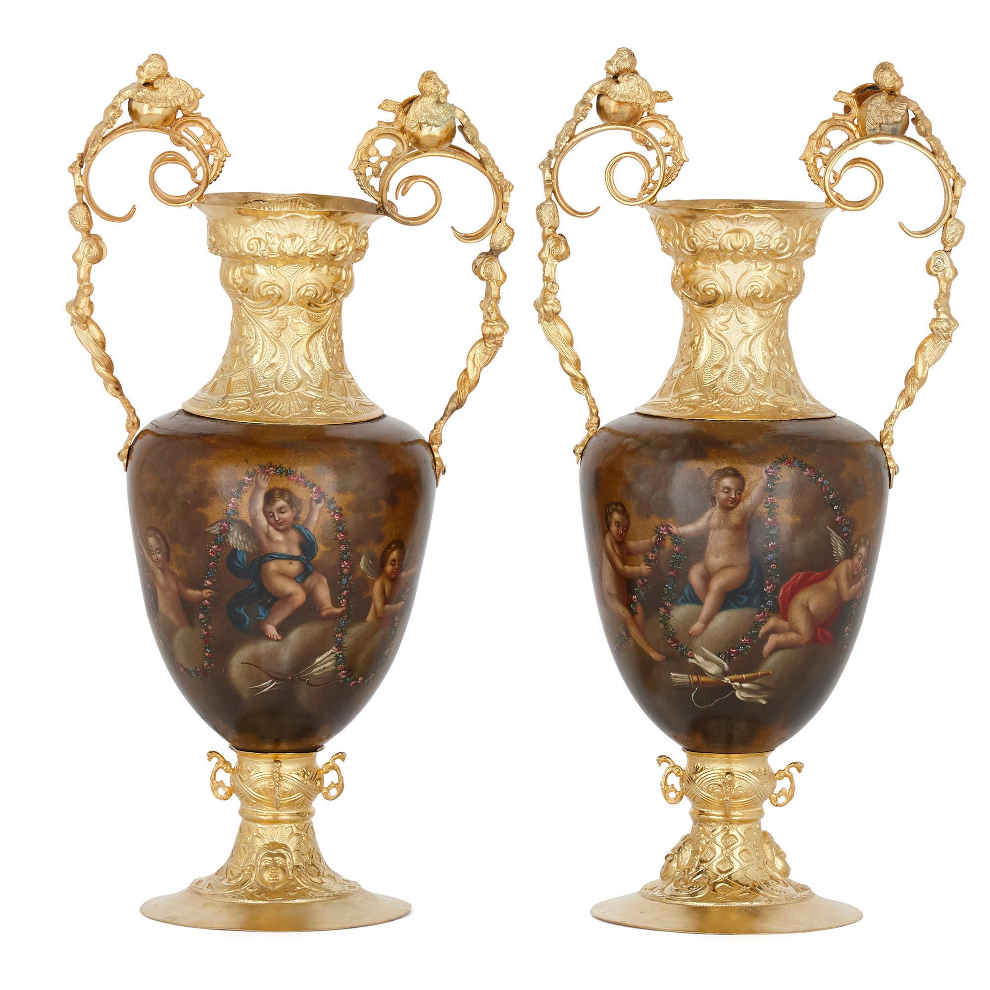 Pair of vermeil and vernis Martin Louis XV style vases
French, 19th century
Measures: Height 37cm, width 19cm, depth 13cm

This beautiful pair of vases features fine silver-gilt mounts and bodies decorated with vernis Martin, the varnishing
