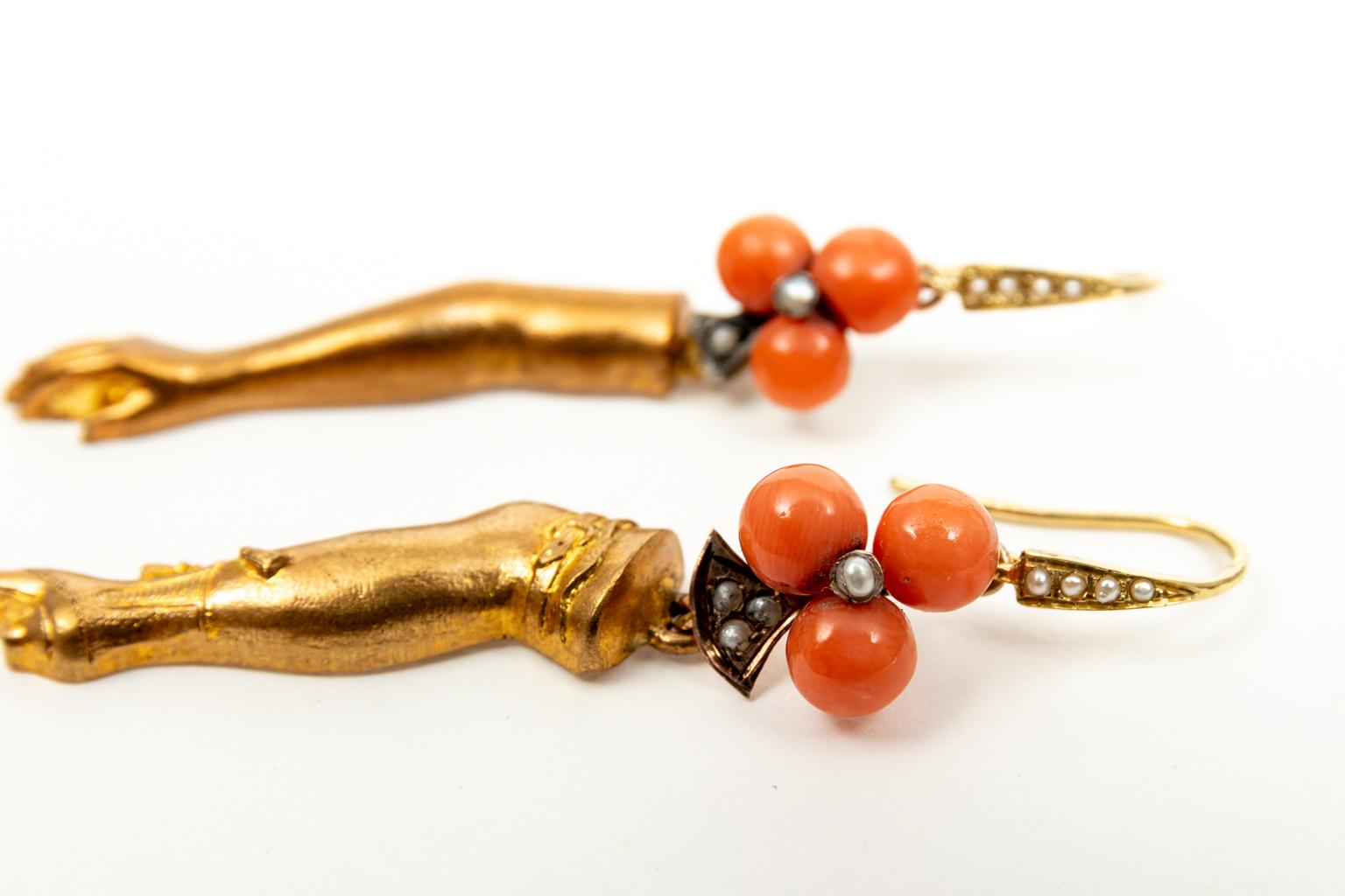 Pair of vermeil arm and leg earrings that feature sterling coral and seed pearl antique clover earrings on 18 karat yellow gold and seed pearl ear wires. Made in the United States by Katherine Wallach. The piece is contemporary made using vintage