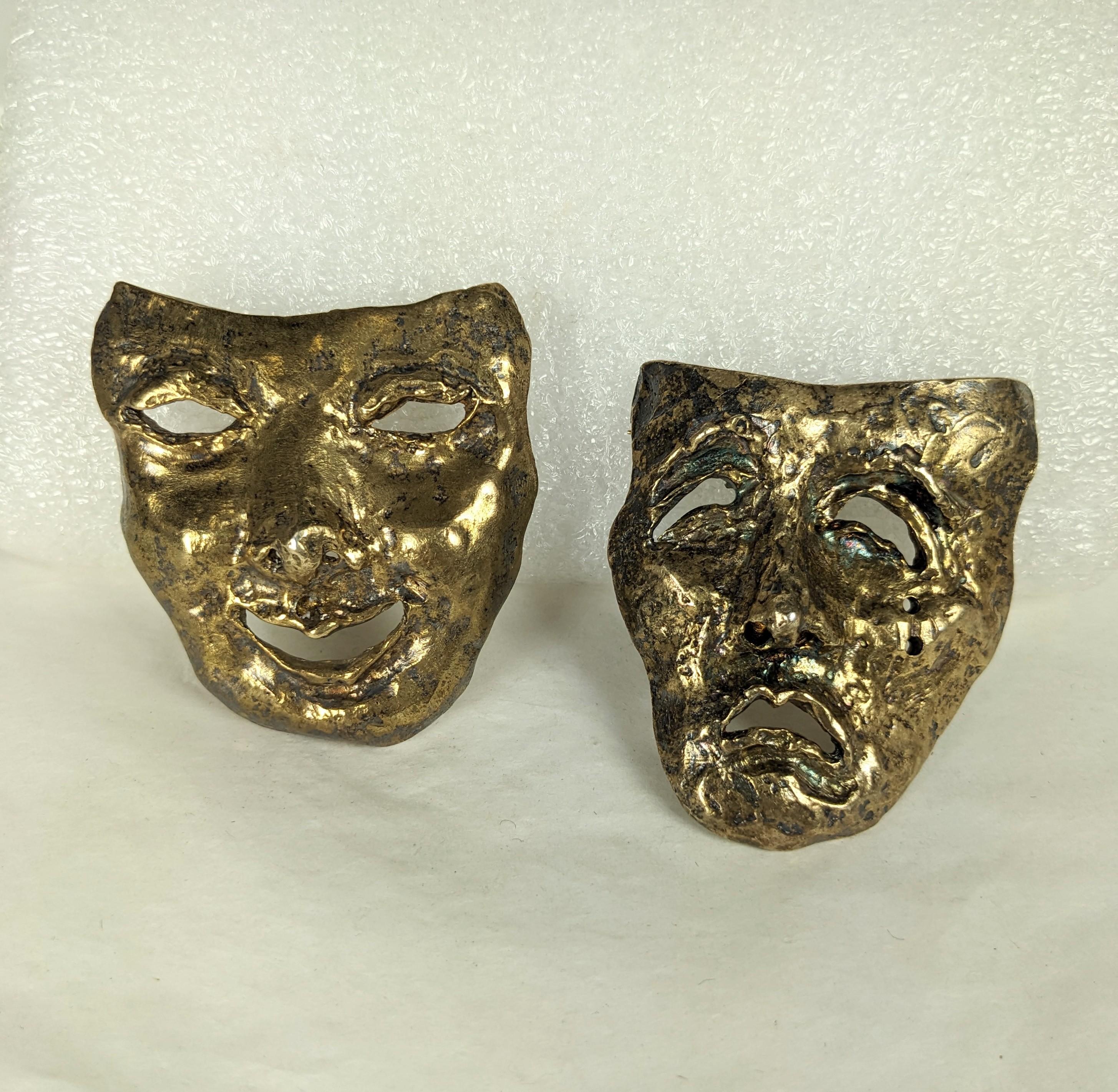 Pair of striking Vermeil Sterling Comedy Tragedy Brooches by Judy Gold circa 1980's. Large in scale with loops for use as pendants as well. Heavy gauge sterling. Each 2.25