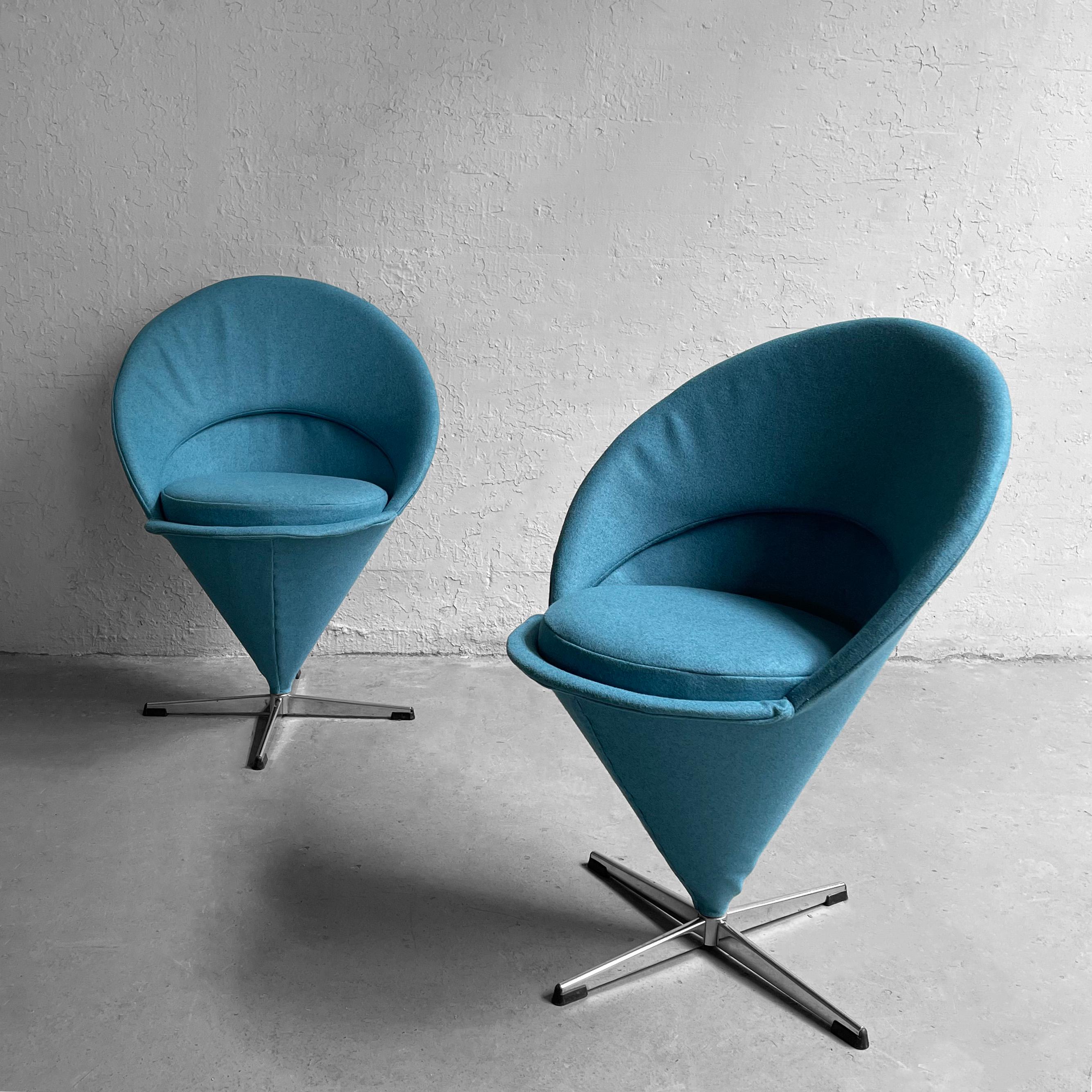 Pair of iconic, Mid-Century Modern, cone chairs by Verner Panton, circa 1960's, swivel on their steel 4 prong bases, upholstered in a playful robin's egg blue, wool blend.