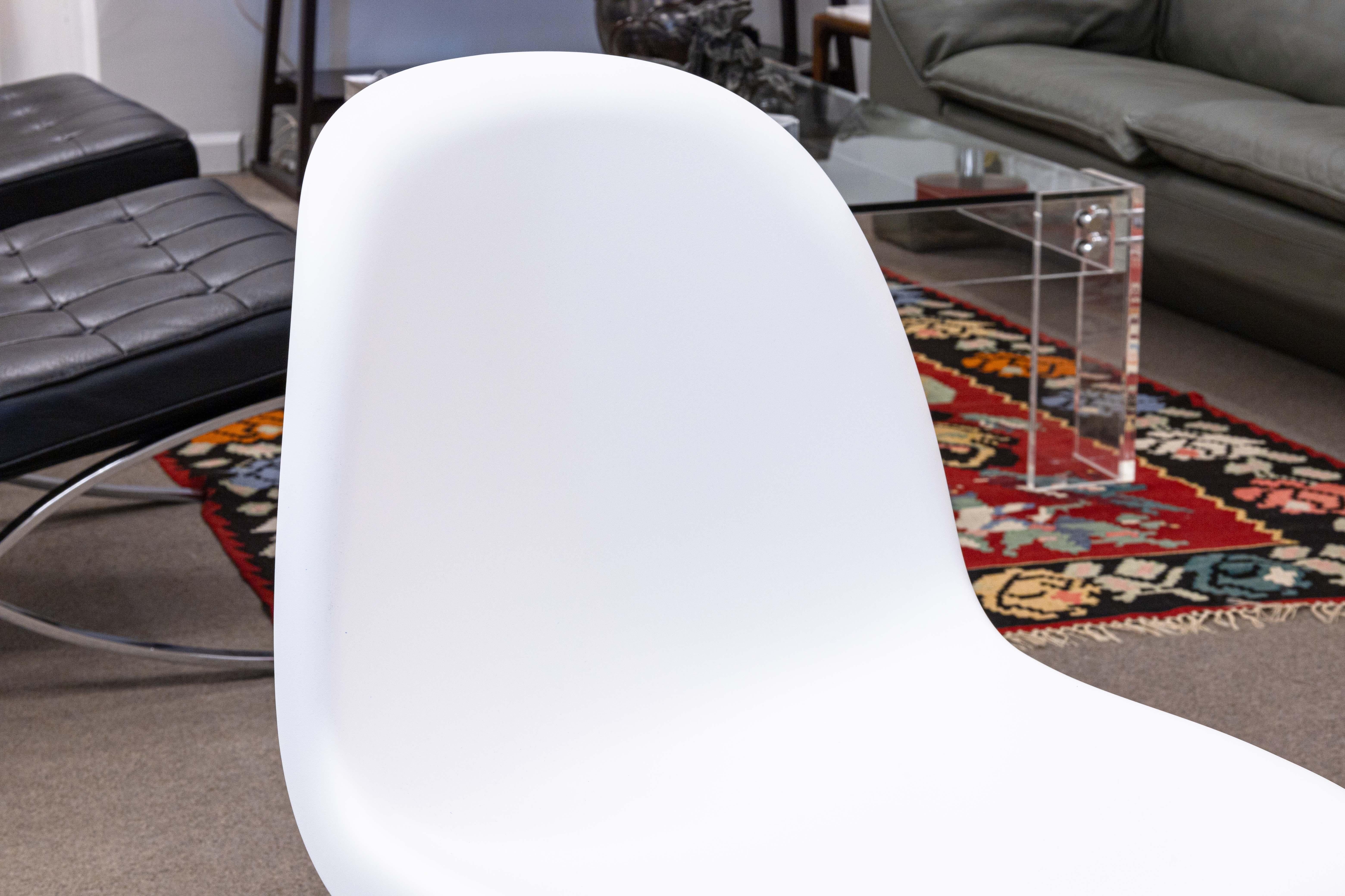 A pair of Verner Panton Design Within Reach Vitra 727 side accent chairs. A lovely piece of design featuring a single piece construction. These chairs have an organic, but abstract presence. This chair takes the idea of the classic cantilever