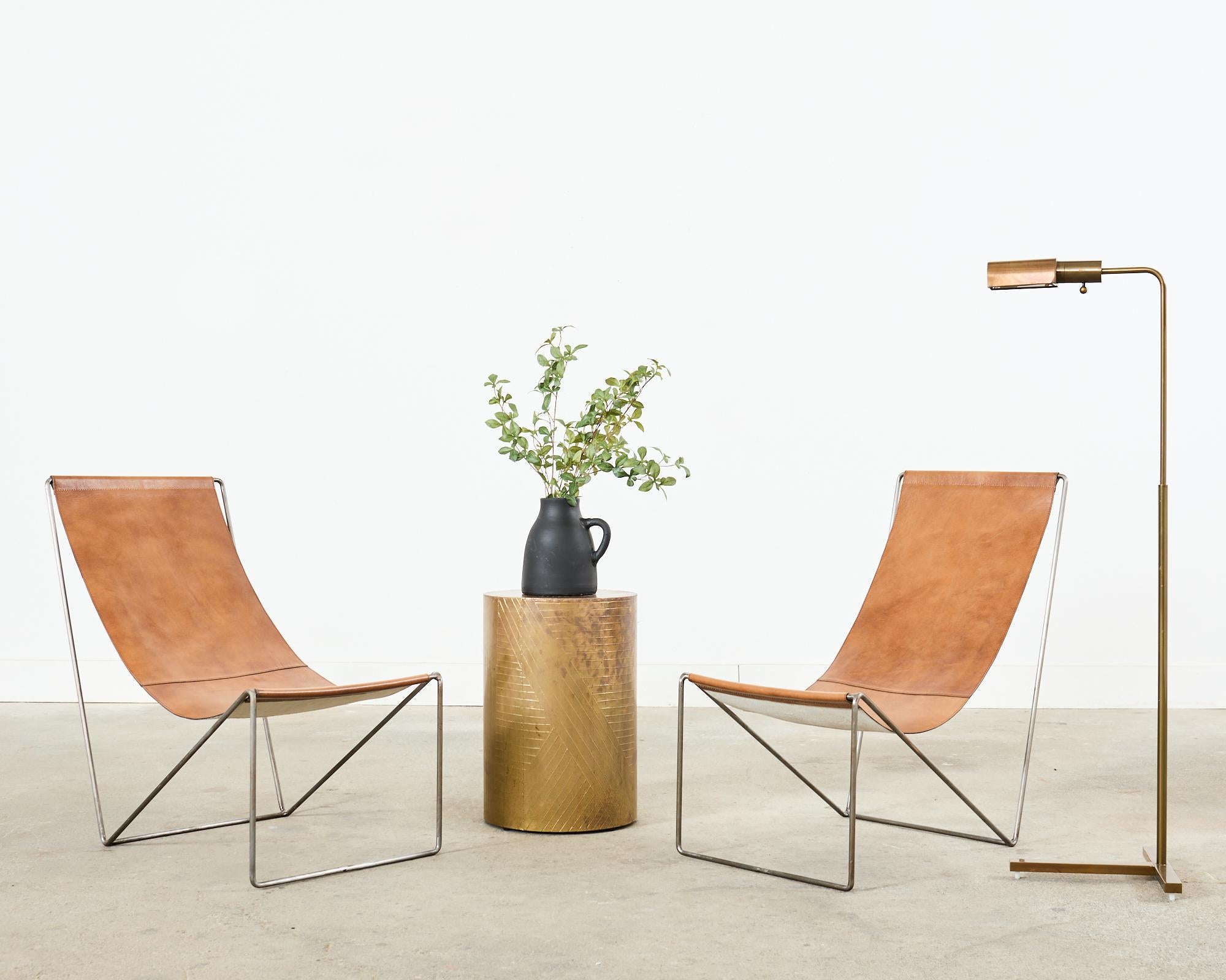 Amazing minimalist design leather sling lounge chairs made in the mid-century Danish modern style and manner of Verner Panton (Danish Designer 1926-1998). Verner's chair design was the inspiration for many later styles such as Michael Verheyden's