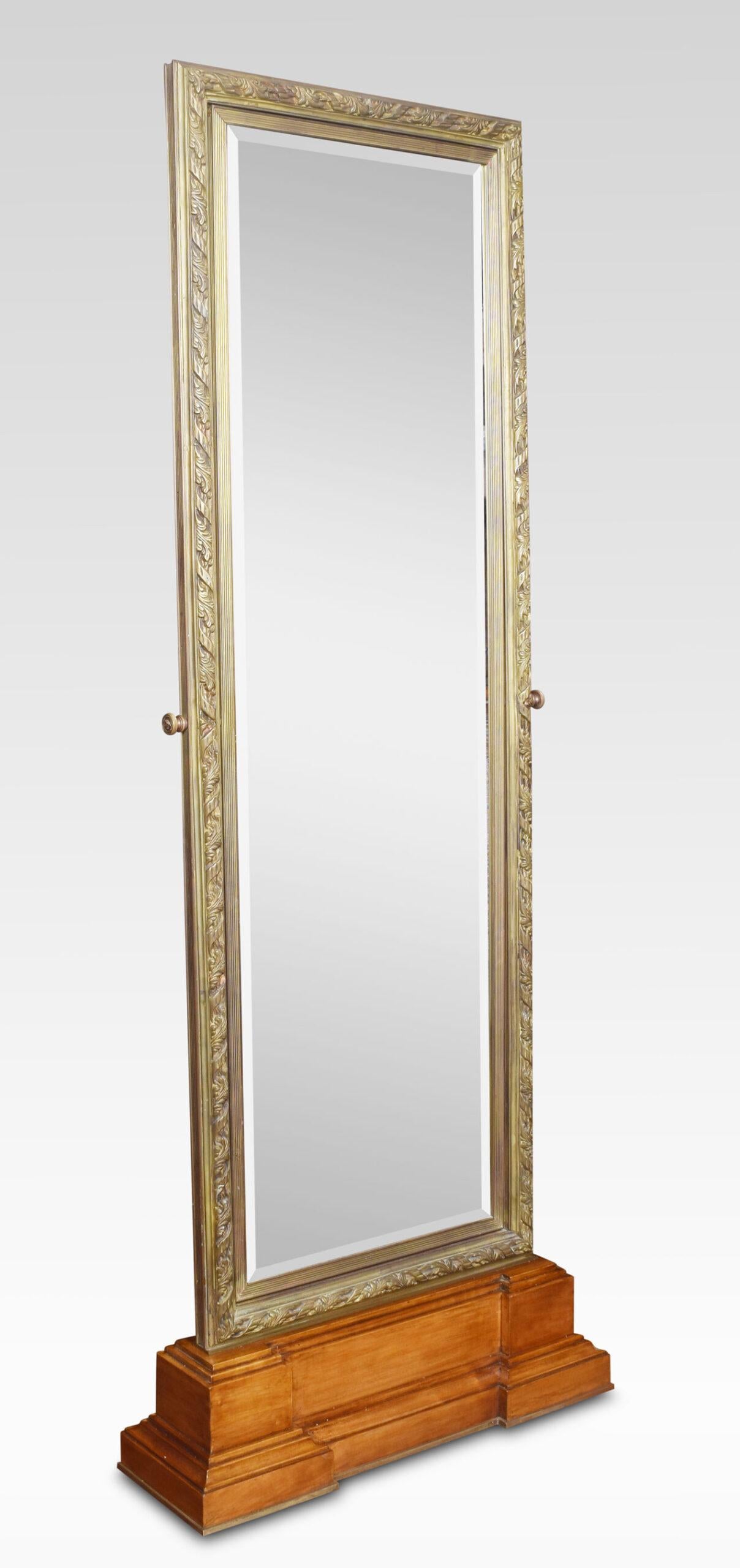 Pair of large tooled bronze framed two-sided cheval mirrors, the rectangular tooled frame enclosing the original adjustable double plate mirror. Raised up on stepped walnut base. The mirrors were purchased from a London Versace showroom when they