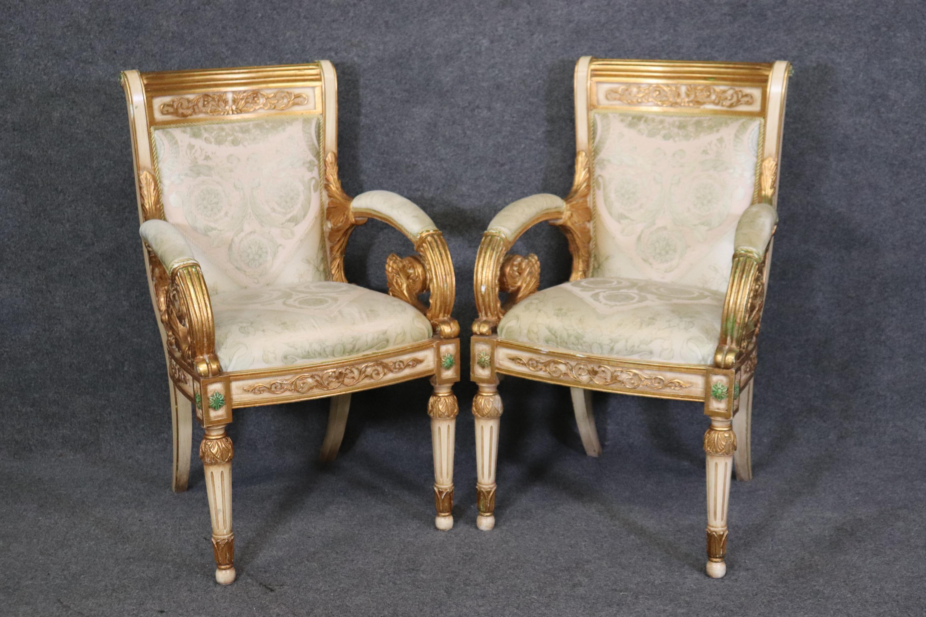 This is a pair, one of two pairs available. This pair has nice older upholstery and beautiful gold leaf finishes and extraordinary carving and detail. They each measures 36 tall x 21.5 wide x 23 deep and a seat height 19 and date to the 1930s era.