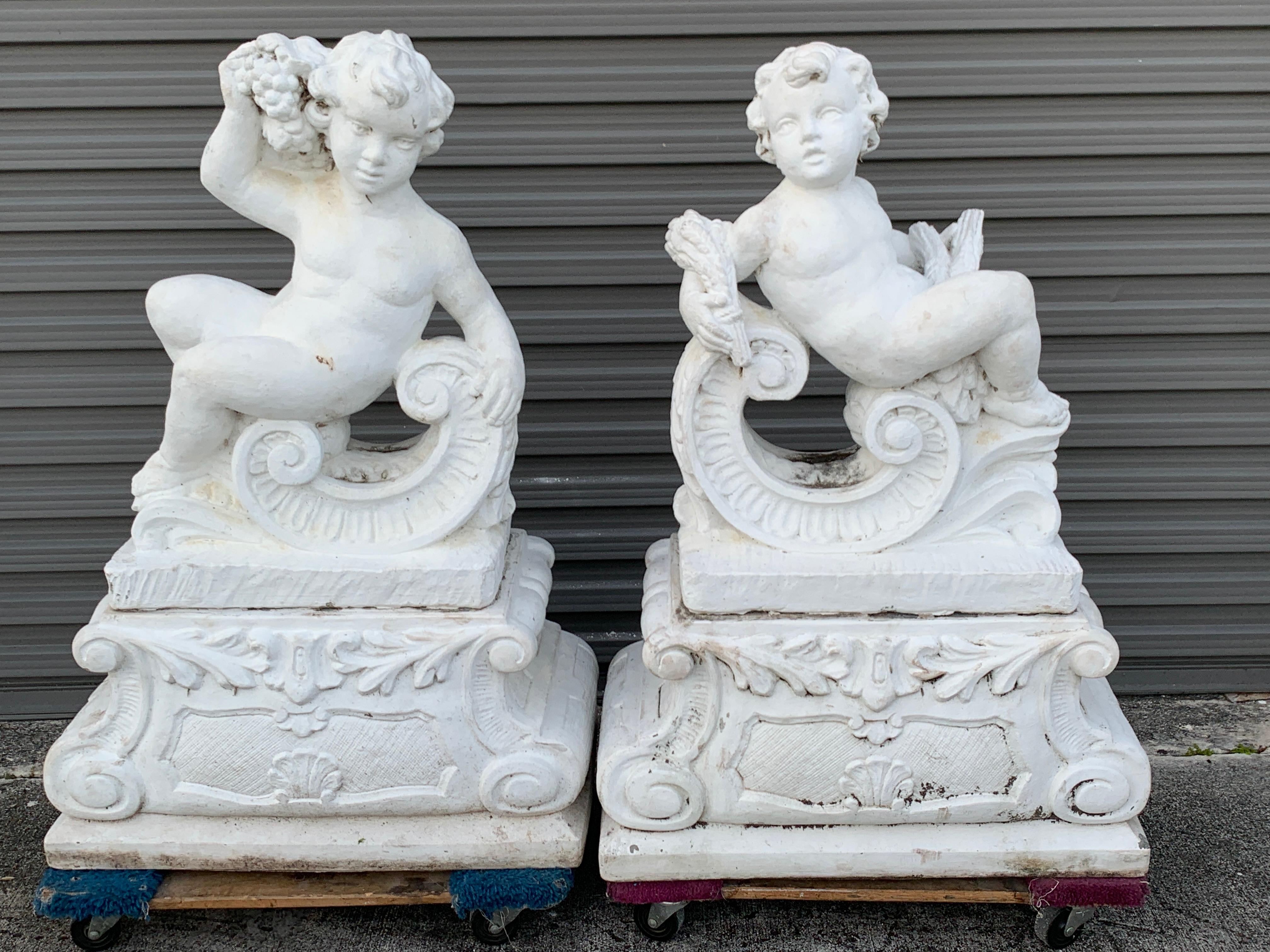 Pair of Vintage Cast Stone Statues of Recumbent Putti on Pedestal Bases
Impressive works, a left and right, beautifully modeled and polychromed white, ready to place
Each figure measures 12