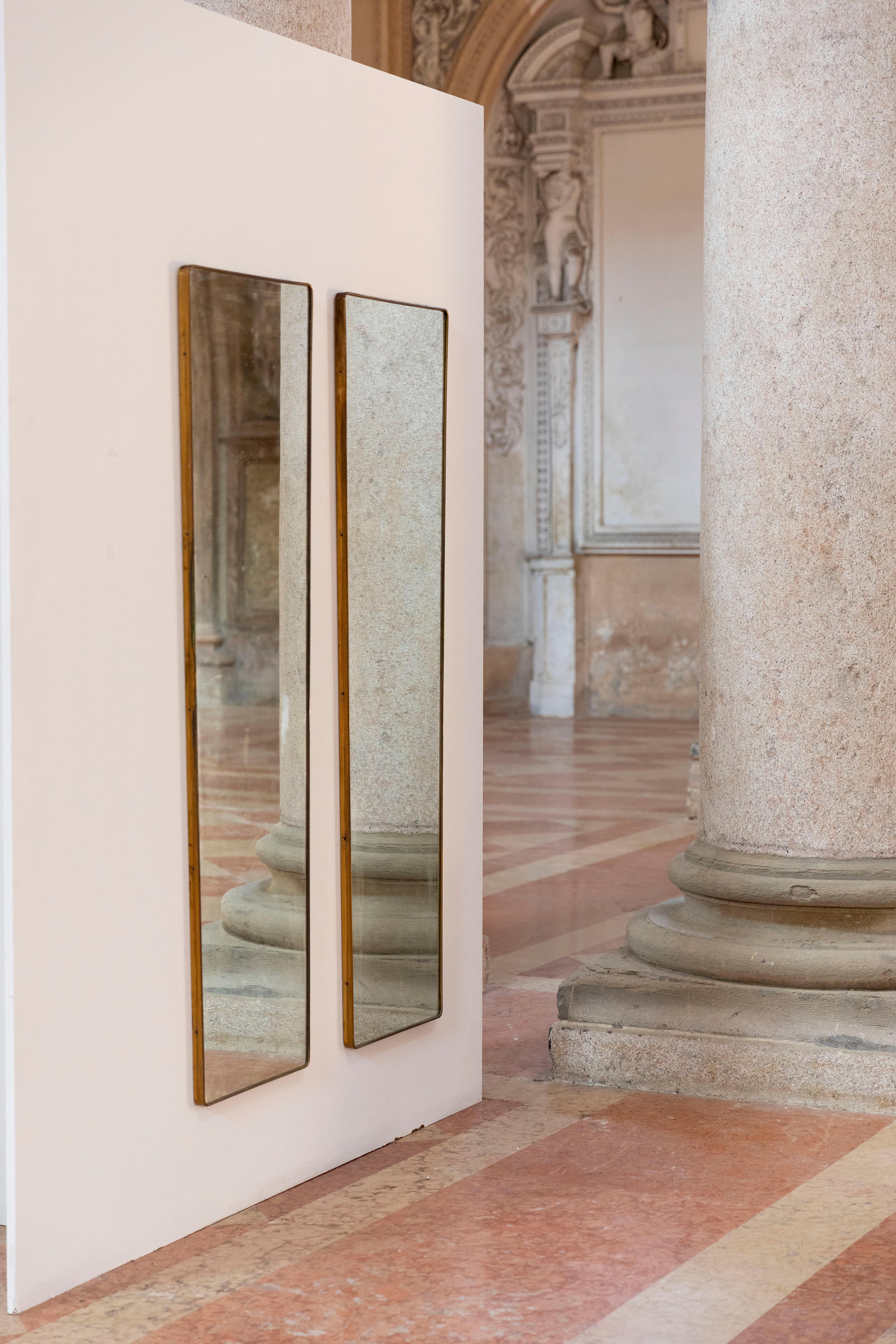 Rare pair of Italian midcentury brass mirrors.
Very elegant in an unusual measures.