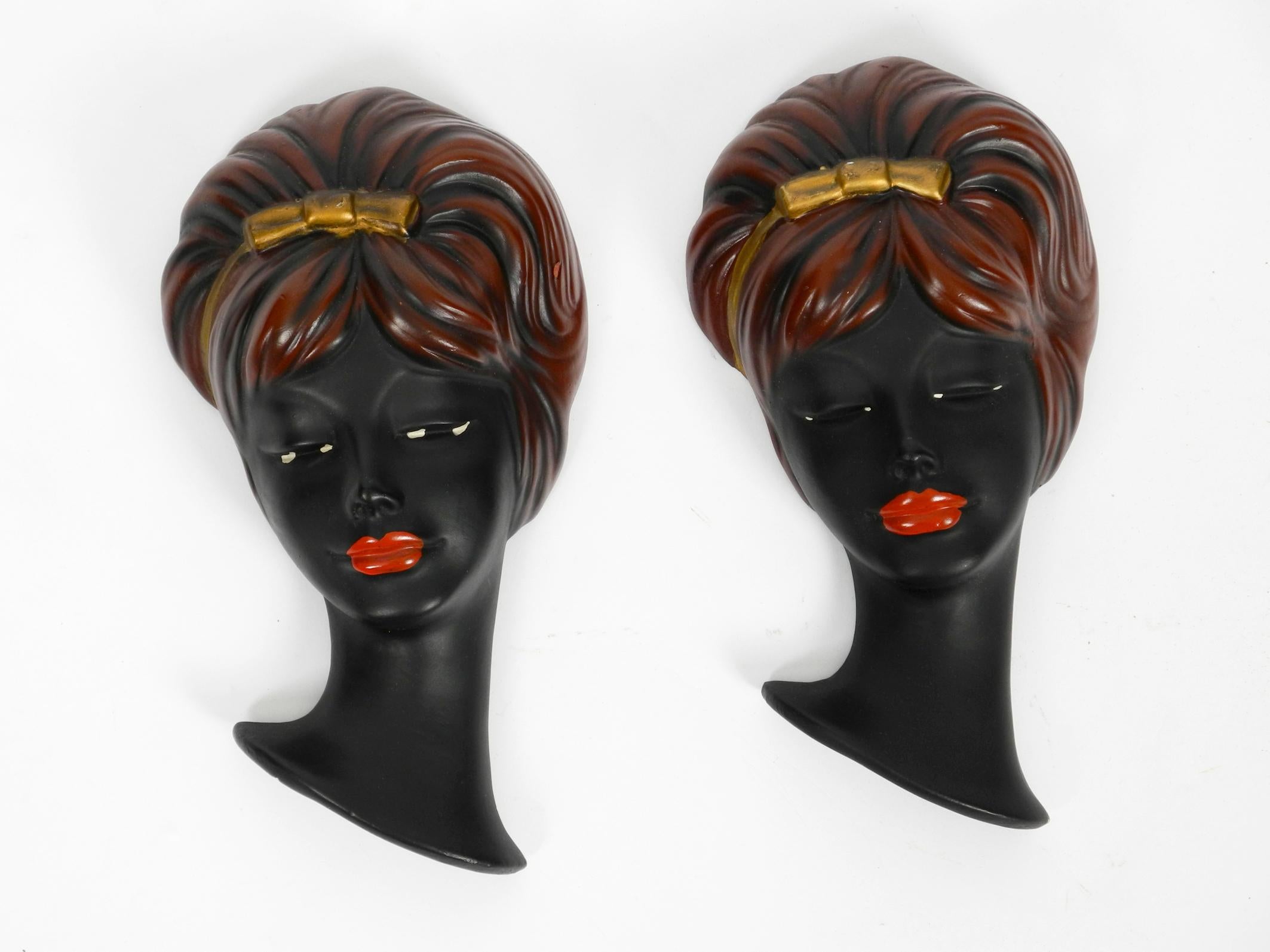 Pair of beautiful hand painted ceramic women's faces
as a wall decoration from the 1950s.
Classic midcentury design. Very high quality and detailed.
Very good condition without chipping or cracks.
Original condition. Very few signs of wear.
A