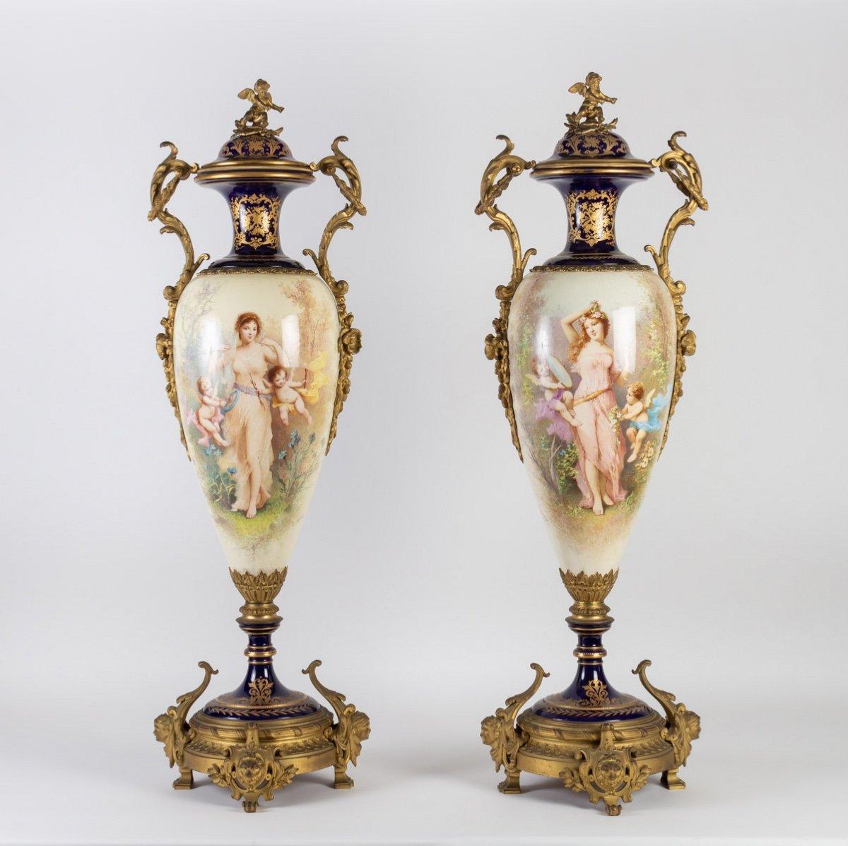 Pair of very Fine Sèvres Porcelain Vases
Very beautiful and important pair of covered vases in polychrome earthenware in the Sèvres white and blue taste with a rich ornamentation in gilt bronzes. The base stands on four feet, two claw feet flanked
