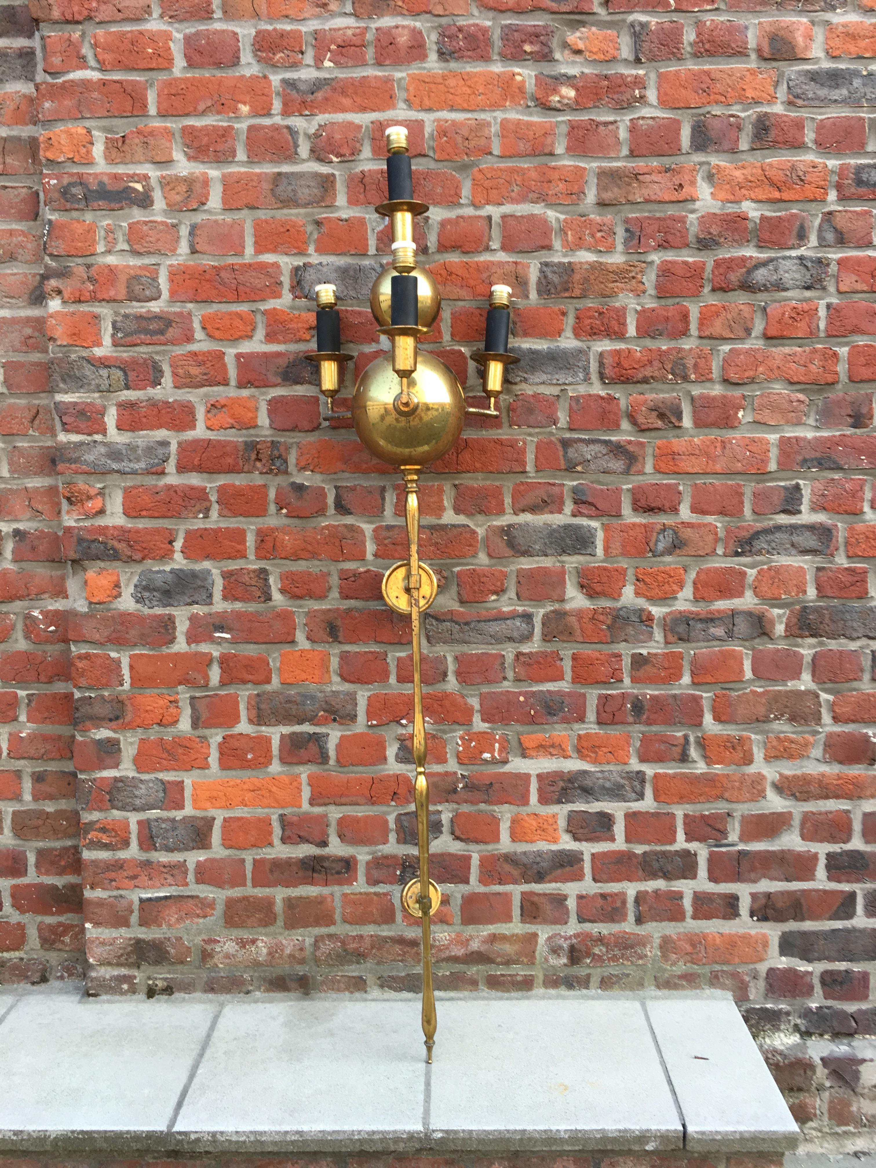 Pair of very large brass sconces, circa 1950,
wear on the brass.