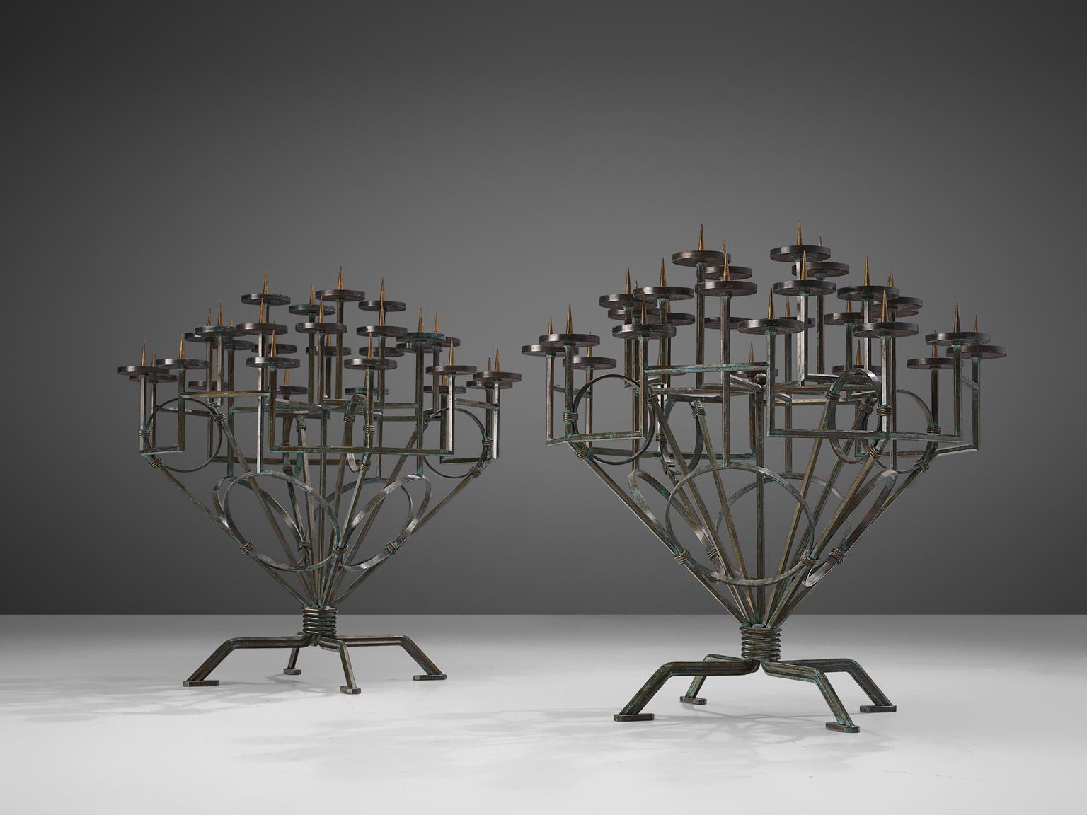 Pair of church candleholders, iron, Europe, early 19th century.

Two exquisite large size candle trees that have probably been housed in a church for many years. These 19th century iron candle holders feature a multi-tiered spread of candle holders