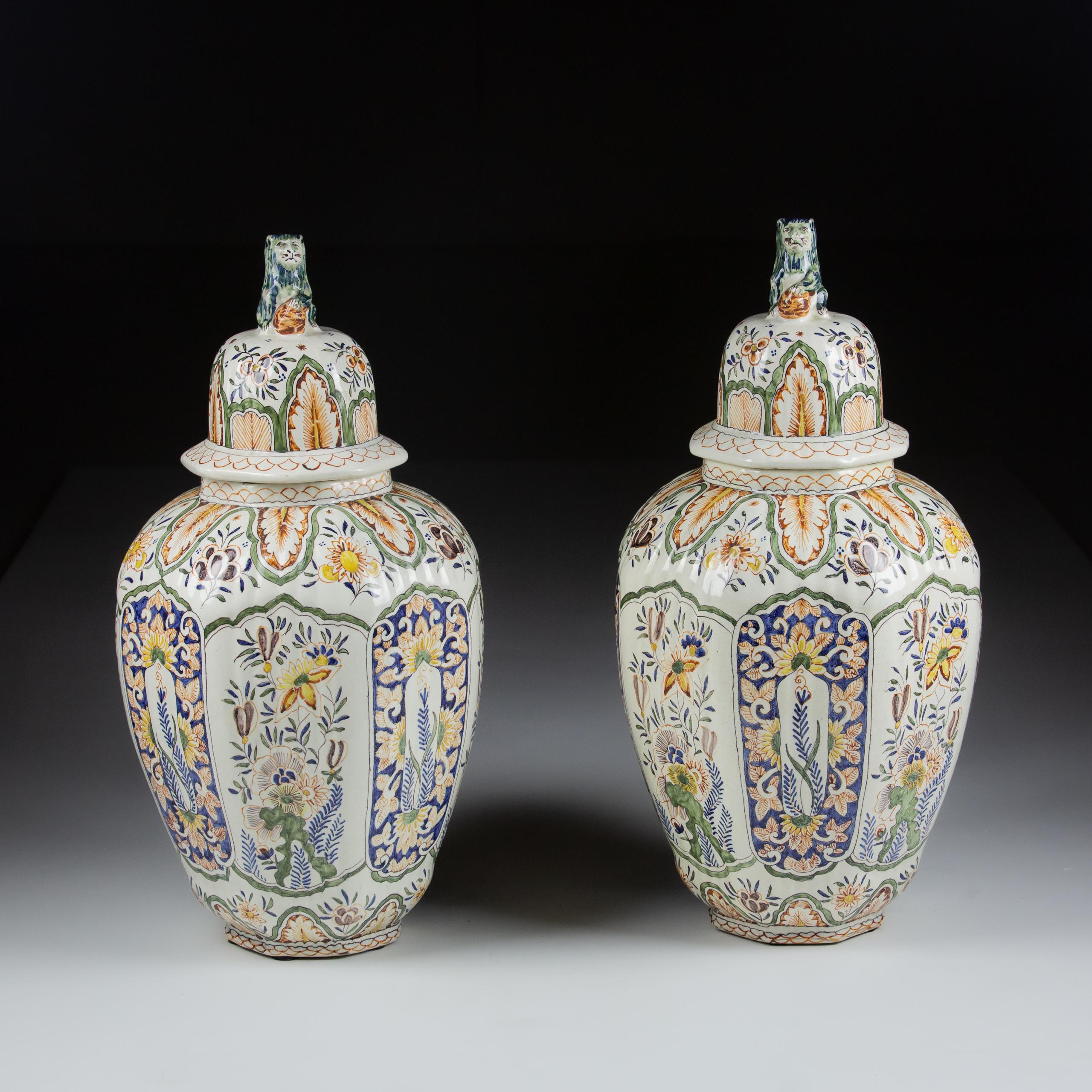 Pair of very Large 19th Century vase.

Desvres, Louis Francois Fourmaintraux. 

Faience, profusely decorated polychrome in the finest of Delft themes of Chinoiserie patterns
Bulbous form, faceted with ribbed bodies, lids surmounted by