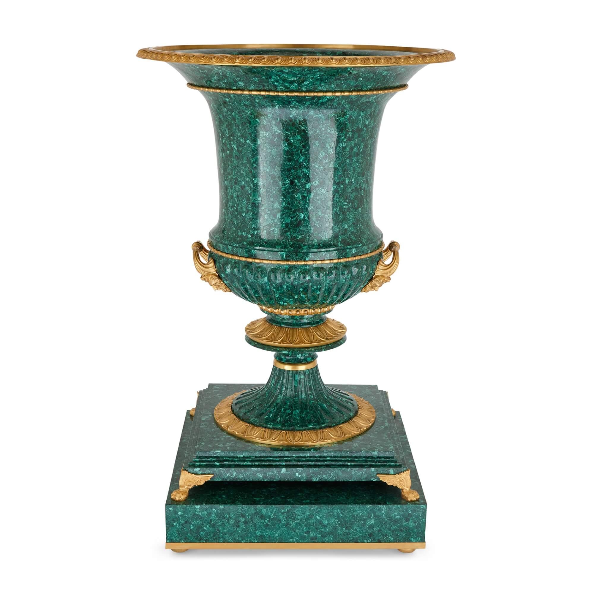 Pair of very large malachite and ormolu vases 
French, 20th Century 
Height 140cm, diameter 91cm

Of impressive size and quality, the vases are made from vibrant green malachite and ormolu. Of Campana form, the body of each vase is adorned with