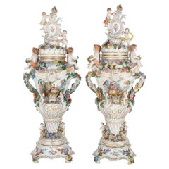 Pair of very large Rococo style Dresden porcelain vases with covers and bases 