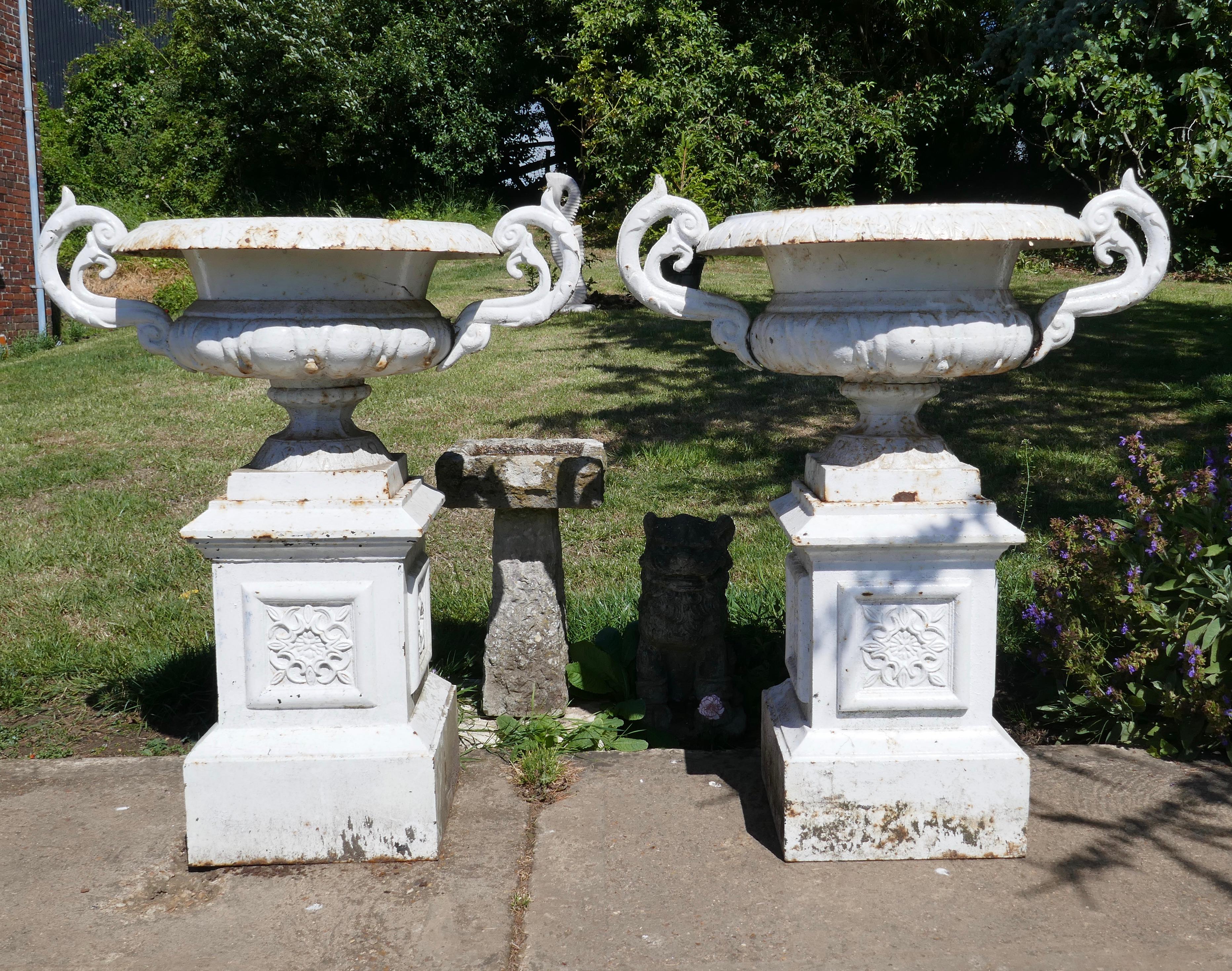 Pair of very large Victorian cast iron garden urns, garden planters

This is a superb and unusually large pair of cast iron urns 
The urns are in good condition for their age, still very sound although they are weather worn and slightly rusty