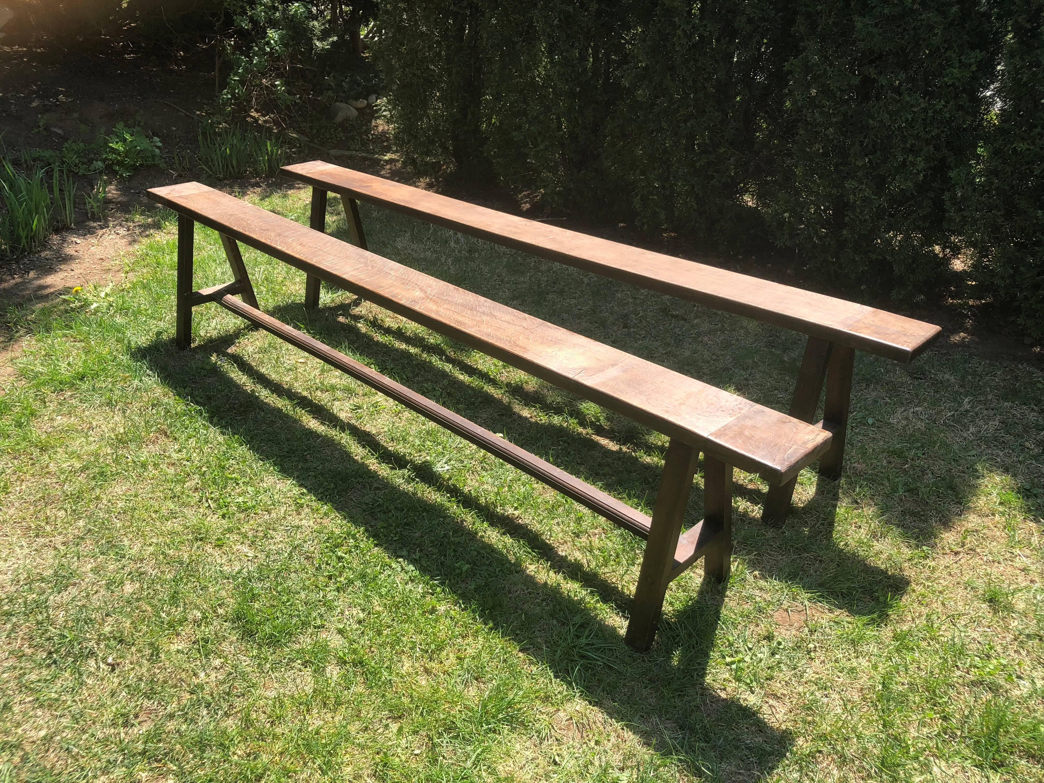 We love long benches and buy them whenever we can, as they are so versatile with a long dining table. This pair is particularly nice and features a strong oak graining, classically-simple form, and chamfered legs. Parts have been pegged together and