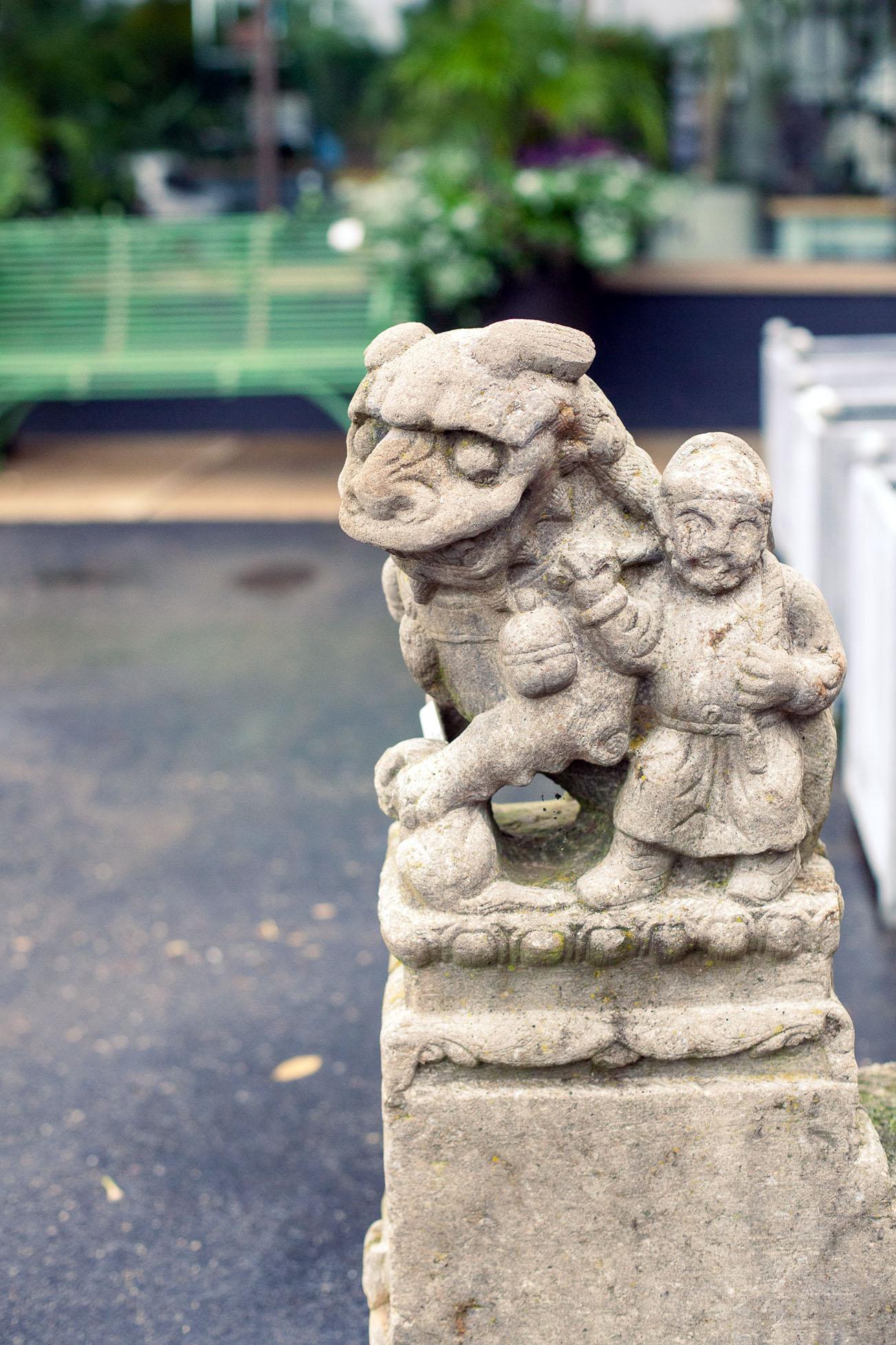Fleurdetroit presents for your consideration a very fine pair of carved antique Foo Dogs.

These stone pieces have a very old weathered surface and would be fabulous additions to any interior or exterior space.