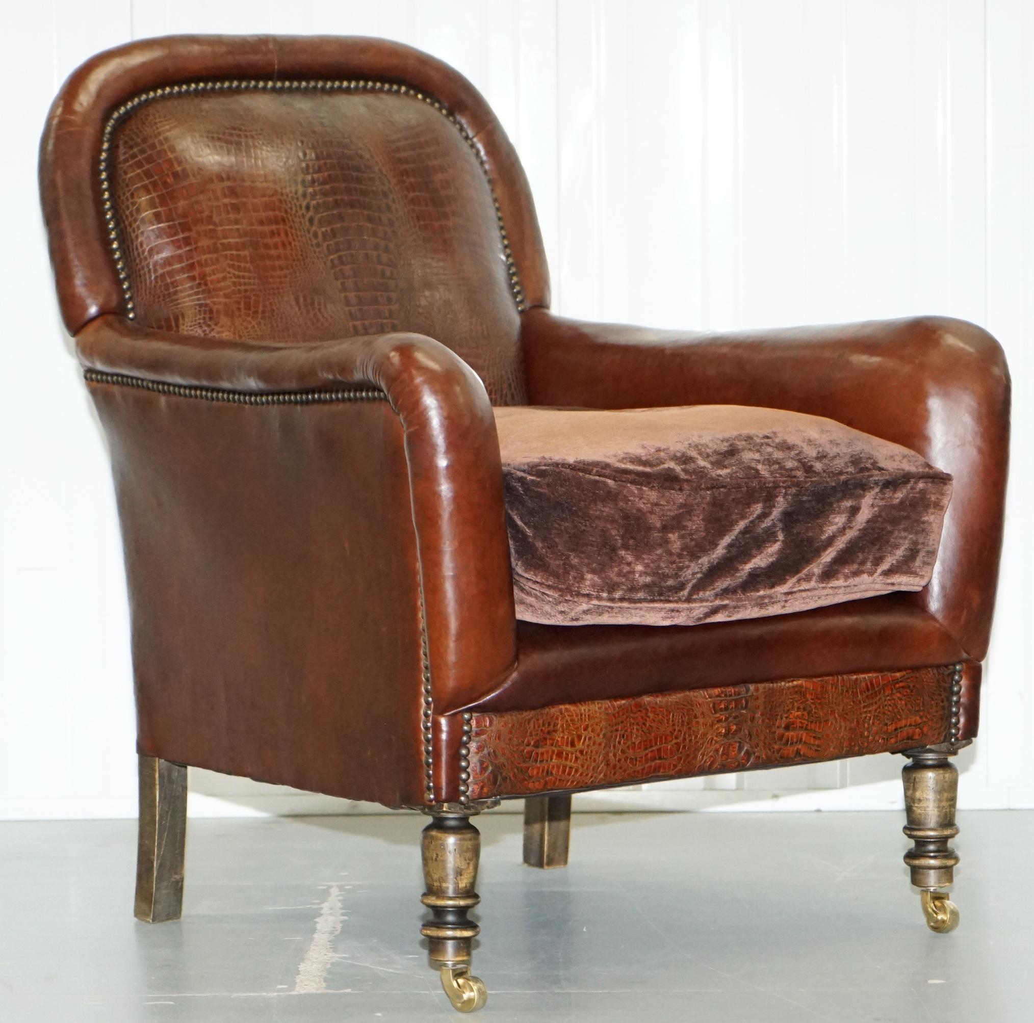 We are delighted to offer for sale this exceptionally rare pair of aged brown leather club armchairs with Alligator or Crocodile patina leather panels

I have never seen another pair like this, the back panels are exquisite, the timber frames are