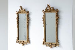 Pair of very refined and elegant carved and gilded wooden