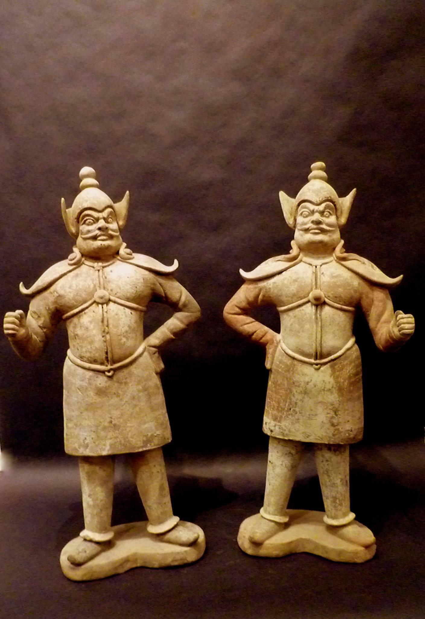 A pair of very refined standing pottery statue of guardians, dramatic facial expression, beautiful detail, early Tang dynasty 618-907, come with one Oxford authentication TL test certificate, Oxford test numbers 102s48.