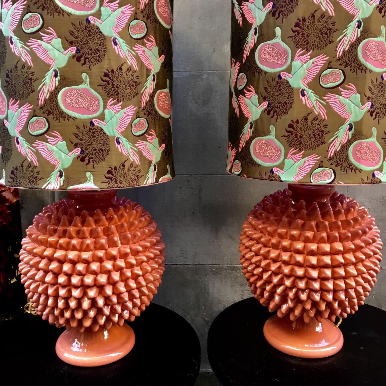 Pair of Vetrified Majolica lamps, salmon pink pine cone shape, new lampshades with Gucci fabric, new electrical system with three bulbs.