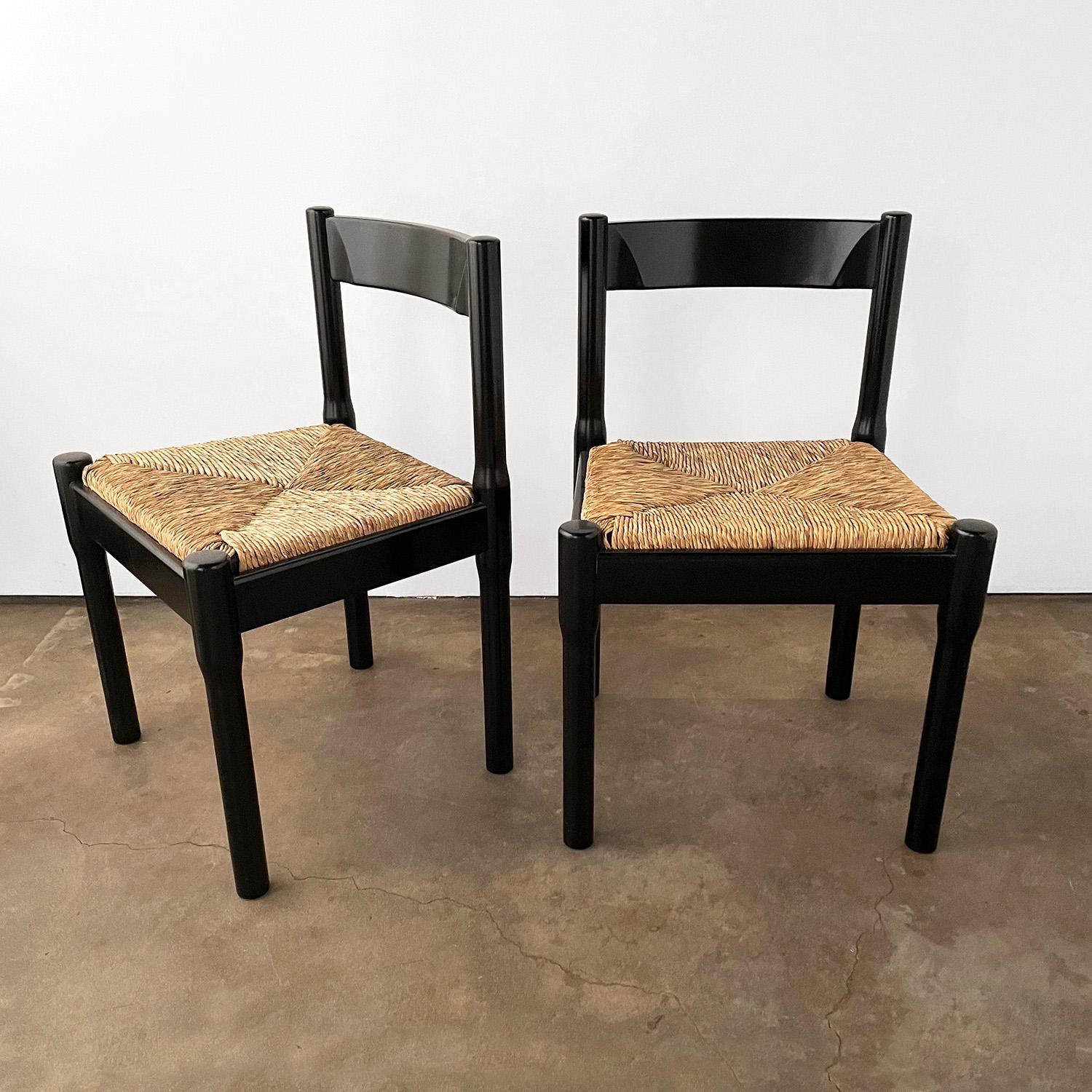 Vico Magistretti “Carimate” chairs
Produced by Cassina in the 1960’s
Black frames with natural woven seats
Timeless classic, modern design
Sold as a pair.