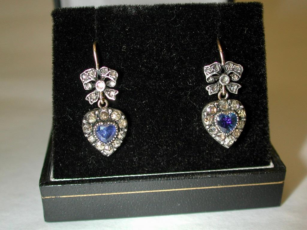 Pair Of Victorian 9ct Gold,Heart Shaped Sapphire & Diamond Earrings,dated Circa 1890
The sapphires and the rose cut diamonds are set in silver, as this is before platinum was used to enhance diamonds and gemstones.
Each earring is backed with 9ct