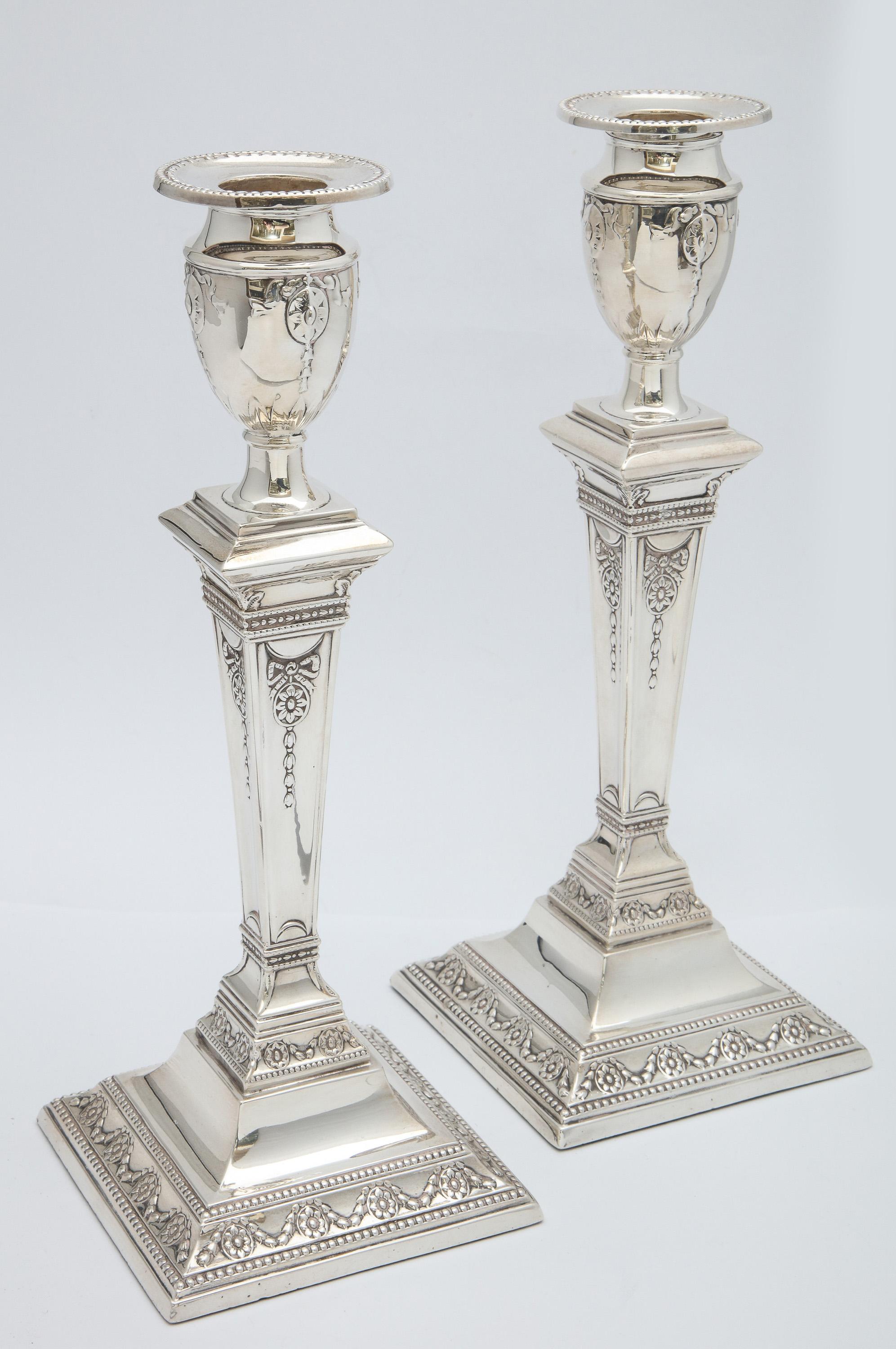 Pair of Victorian, Adam-Style, sterling silver candlesticks, Sheffield, England, 1898, William Charles Fordham and Albert Faulkner (Fordham and Faulkner) - makers. Each candlestick measures 10 inches high x 4 inches wide (across square base) x 4