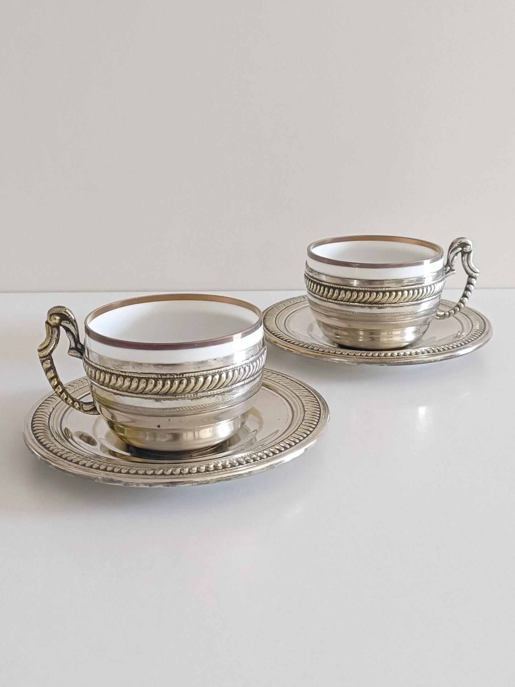 A gorgeous pair of Victorian mid 19th century alpaca silver and china tea or coffee cups and plates. 

Ideal to serve a beautiful breakfast or tea/coffee table.

Dimensions:
Cup: H. 6cm W. 8cm
Plate: Diameter 13.5cm
