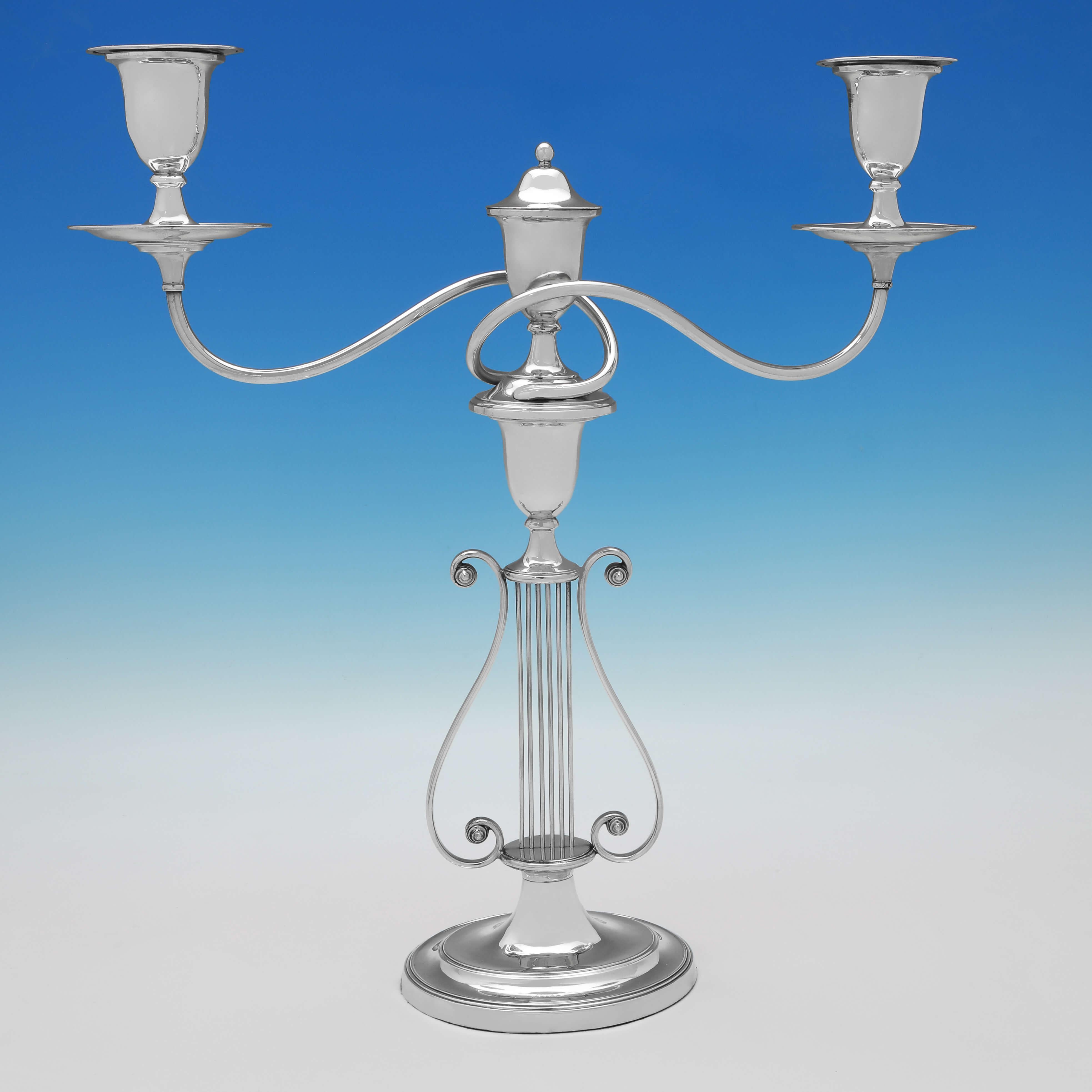 Made in London circa 1880, this charming pair of Antique, Silver Plated Candelabra, are in the 'Lyre' design, with each holding 2 candles. 

Each candelabrum measures 17.75