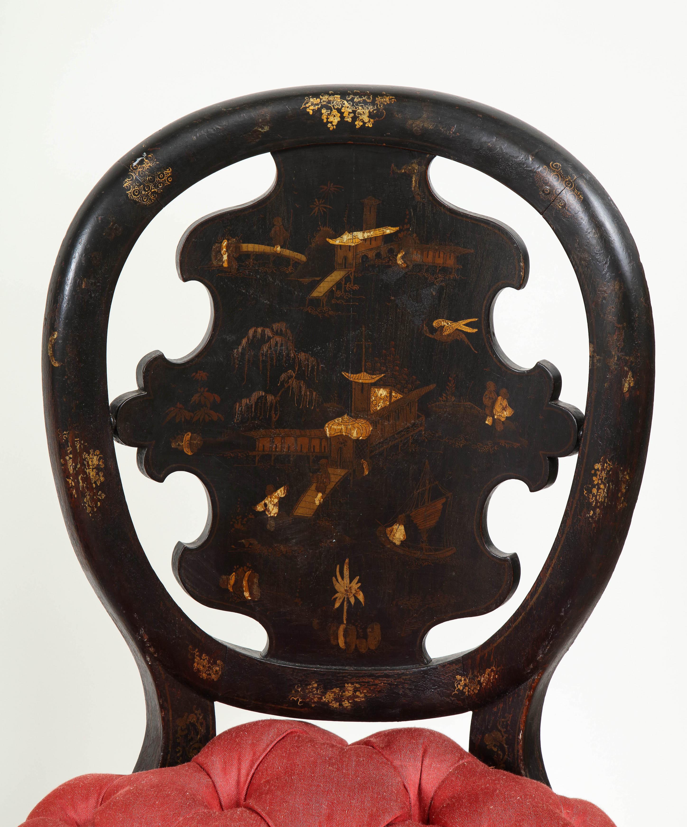 Each with rounded back centered by a shaped backsplash decorated with chinoiserie decoration of temples and pagodas in a riverscape setting; the tufted seat over a seat rail and round tapering legs decorated with foliate scrollwork.