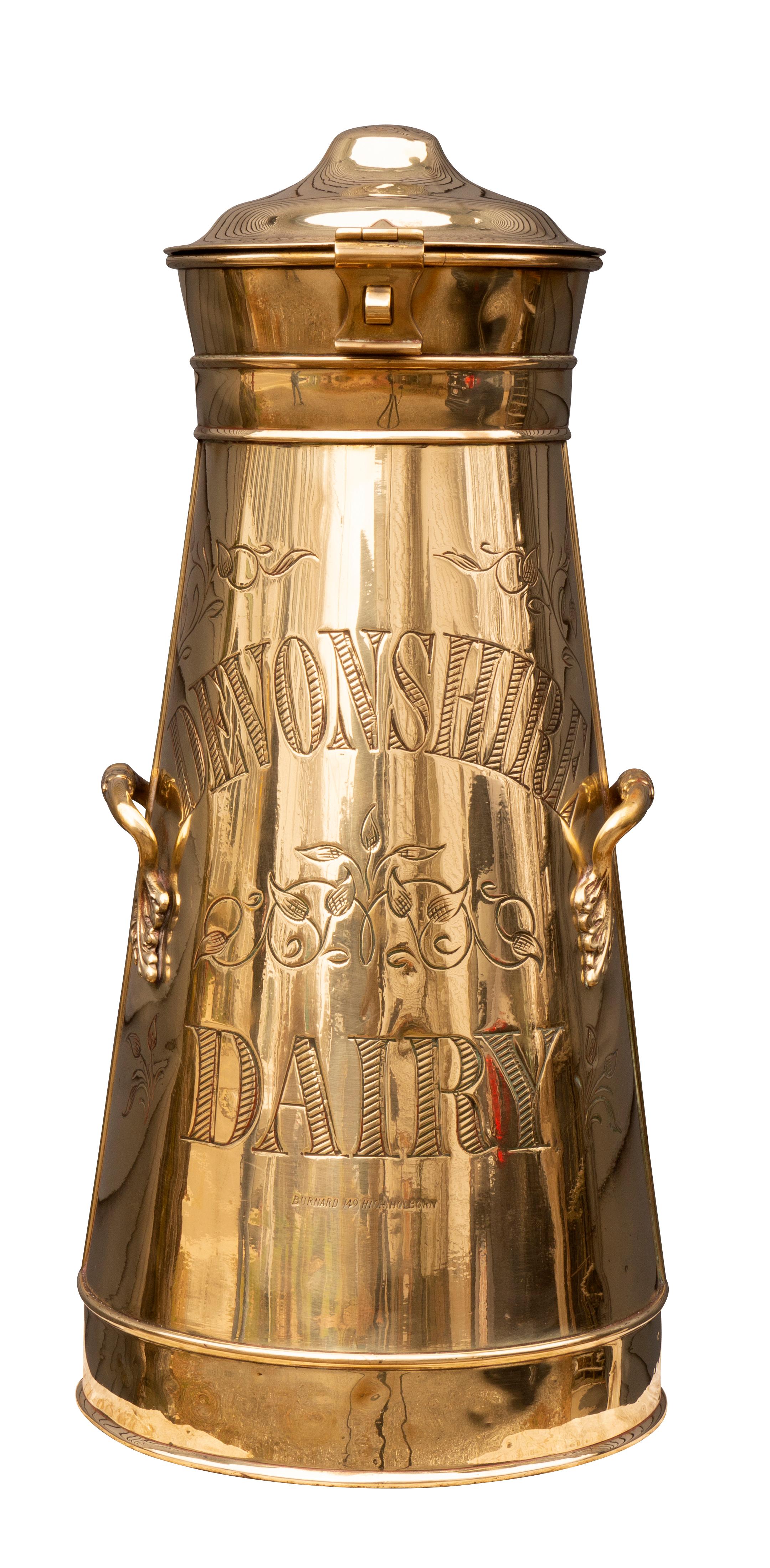 With covers and tapered cylindrical body with inscription for Devonshire Dairy. Side handles. Belleview Ave , Newport RI collection heirs of A.B. Dick.