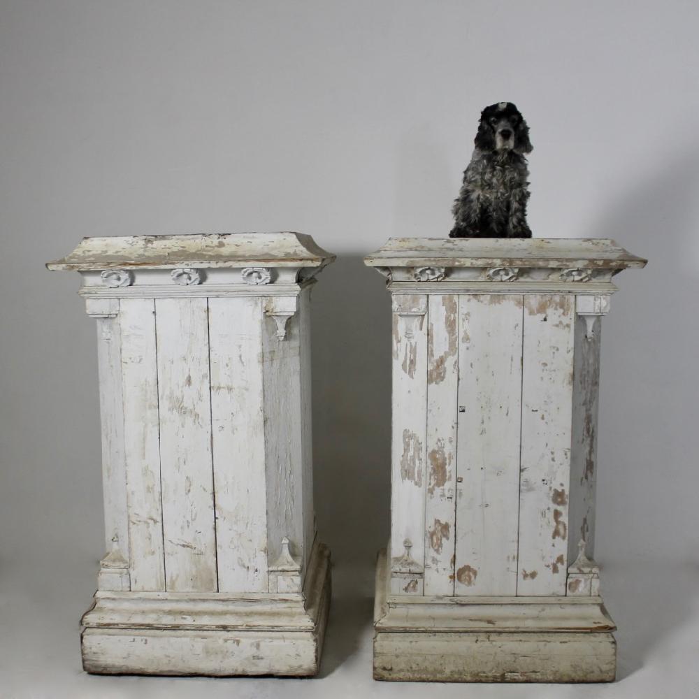 A huge pair of late 19th century pine pedestals of country house proportions. Retaining their original grey paint which is now beautifully flaky, weathered and worn, the moulding with a hint of Gothic influence. 

English late 19th century.
  