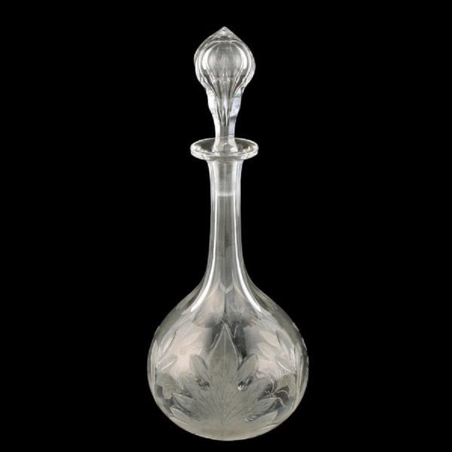 Pair of Victorian engraved and cut glass decanters and stoppers.


The decanters have a star cut base, acid engraved leaf decorations to the body and facet cut long hexagonal necks.

The tall stoppers are hollow, hexagonal in shape and with a