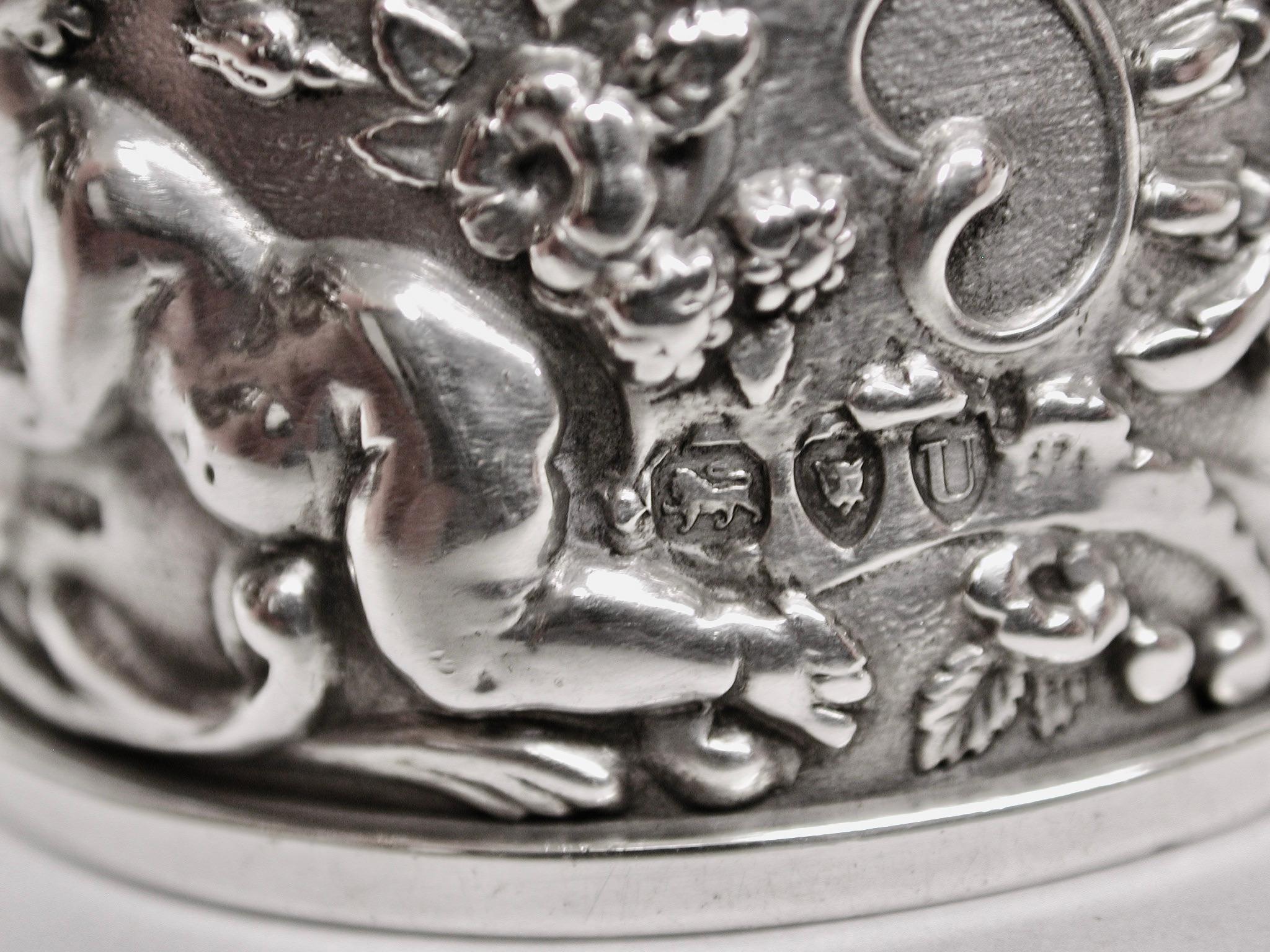 Pair of Victorian Embossed silver napkin rings, dated 1895, William Richard Corke
Assayed in London, decorated with beautiful cherubs,flowers and various scrolls.