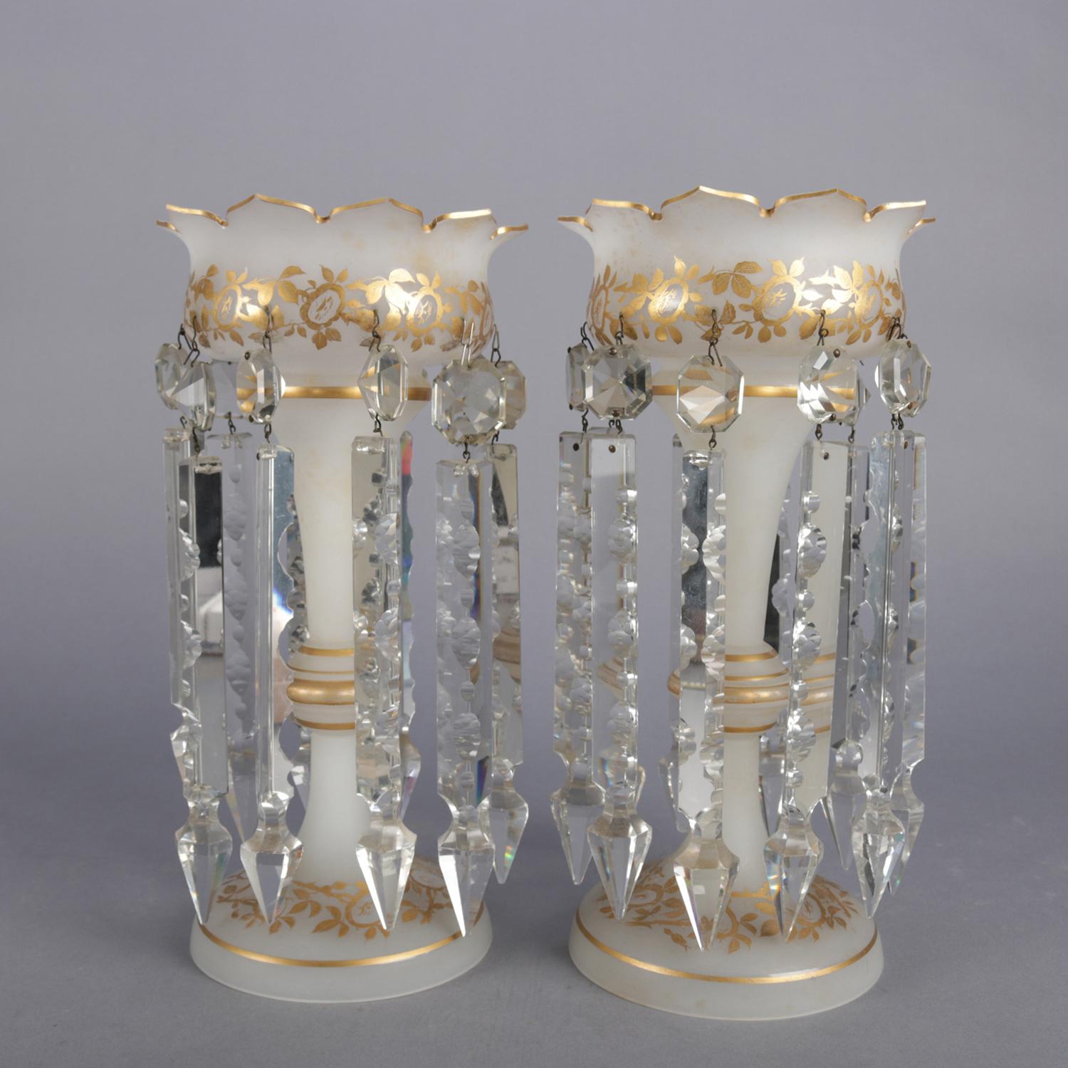 Pair of Victorian frosted mantle lusters feature frosted glass construction with flared scallop opening and hand painted gilt foliate decoration with hanging cut crystal prisms, circa 1890

Measures: 12.5