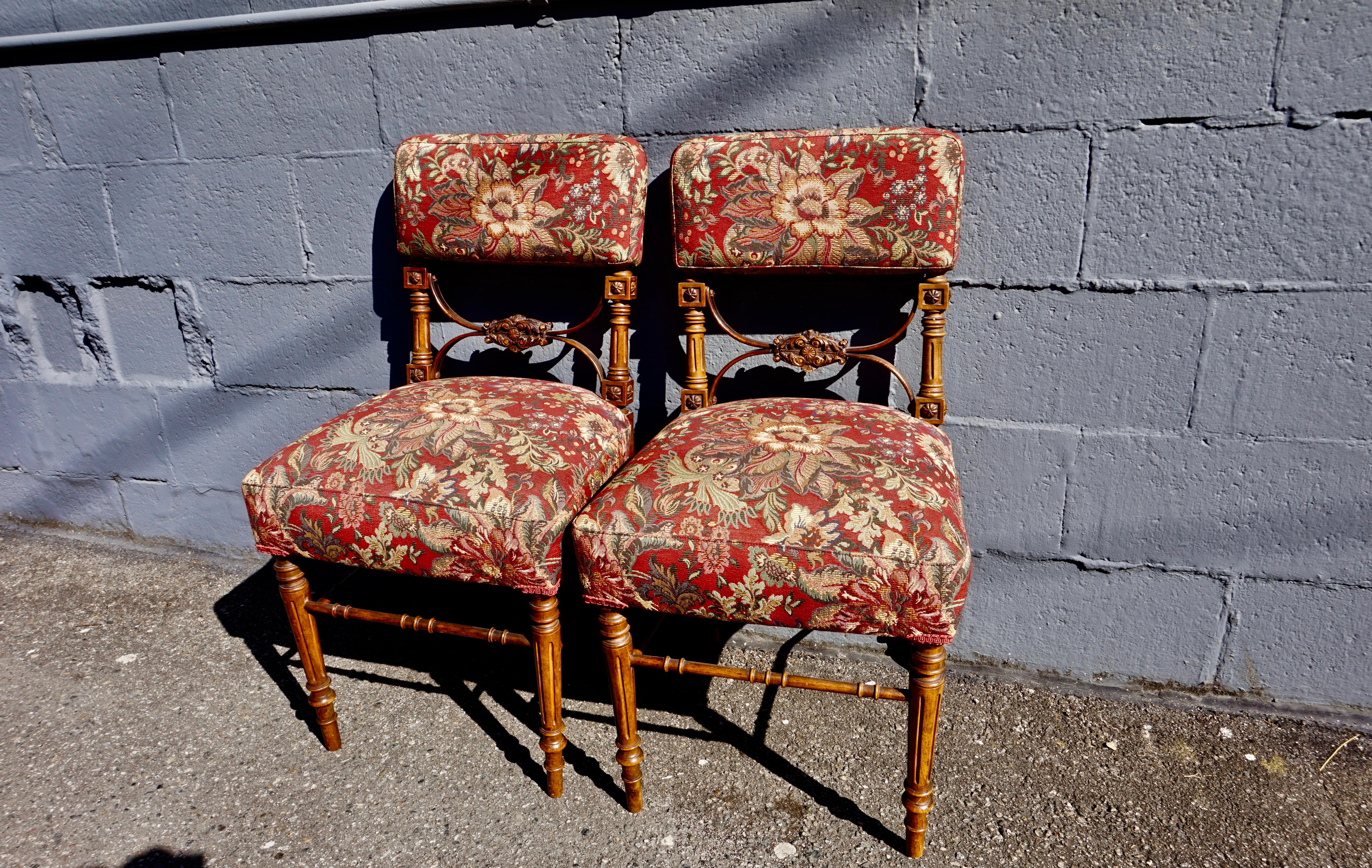 Rare occasional Gothic chairs with excellent detail, tapering fluted legs united by stretchers and re-upholstered in Botanical fabric. Good condition.