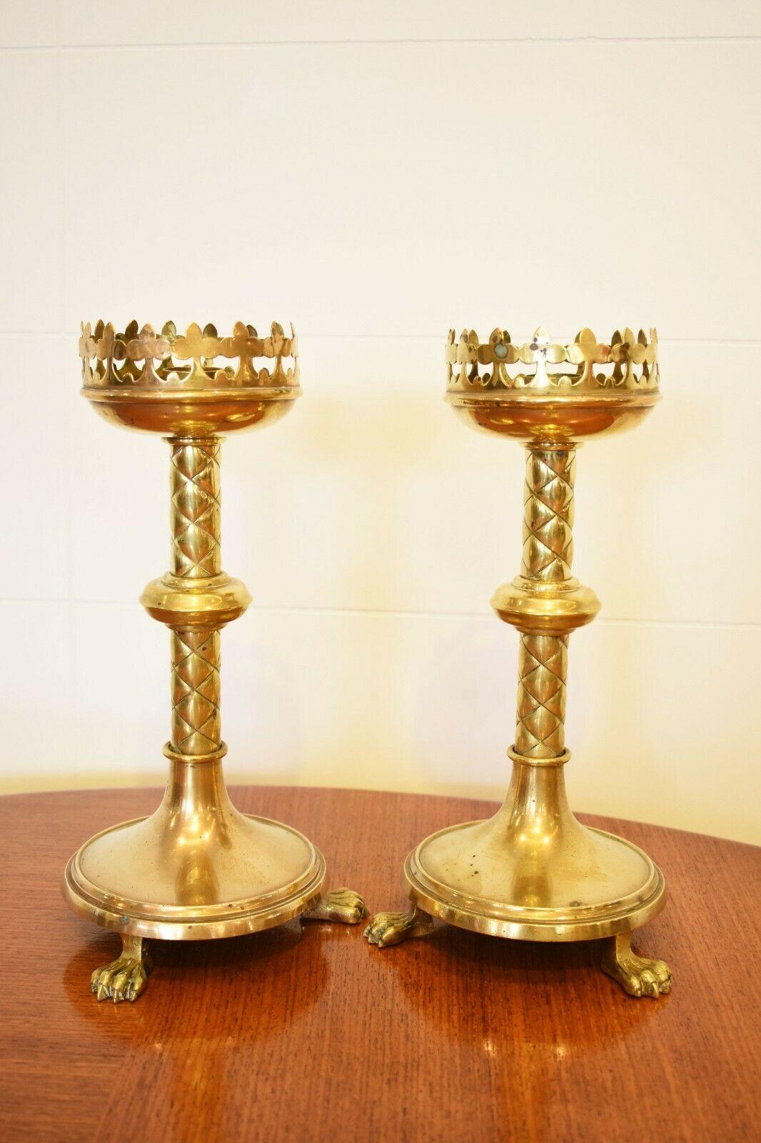 Victorian Gothic Revival brass candelabra / candle holders 

This pair of Victorian brass candelabras are a perfect example of the gothic revival period that began in the second half of the 18th century, through to the 19th Century.

Featuring a