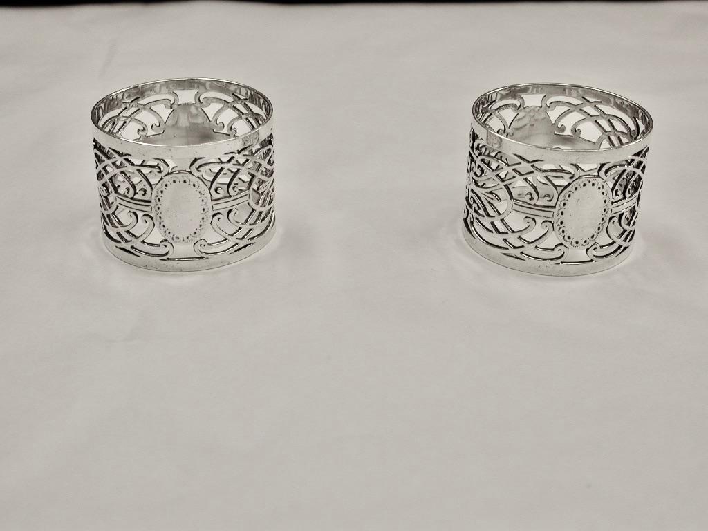 Pair of Victorian hand pierced silver napkin rings,1898,Jackson & Fullerton,London
Heavy gauge of silver with hand piercing, which is done with a small fret saw.
This design is quite unique.
 