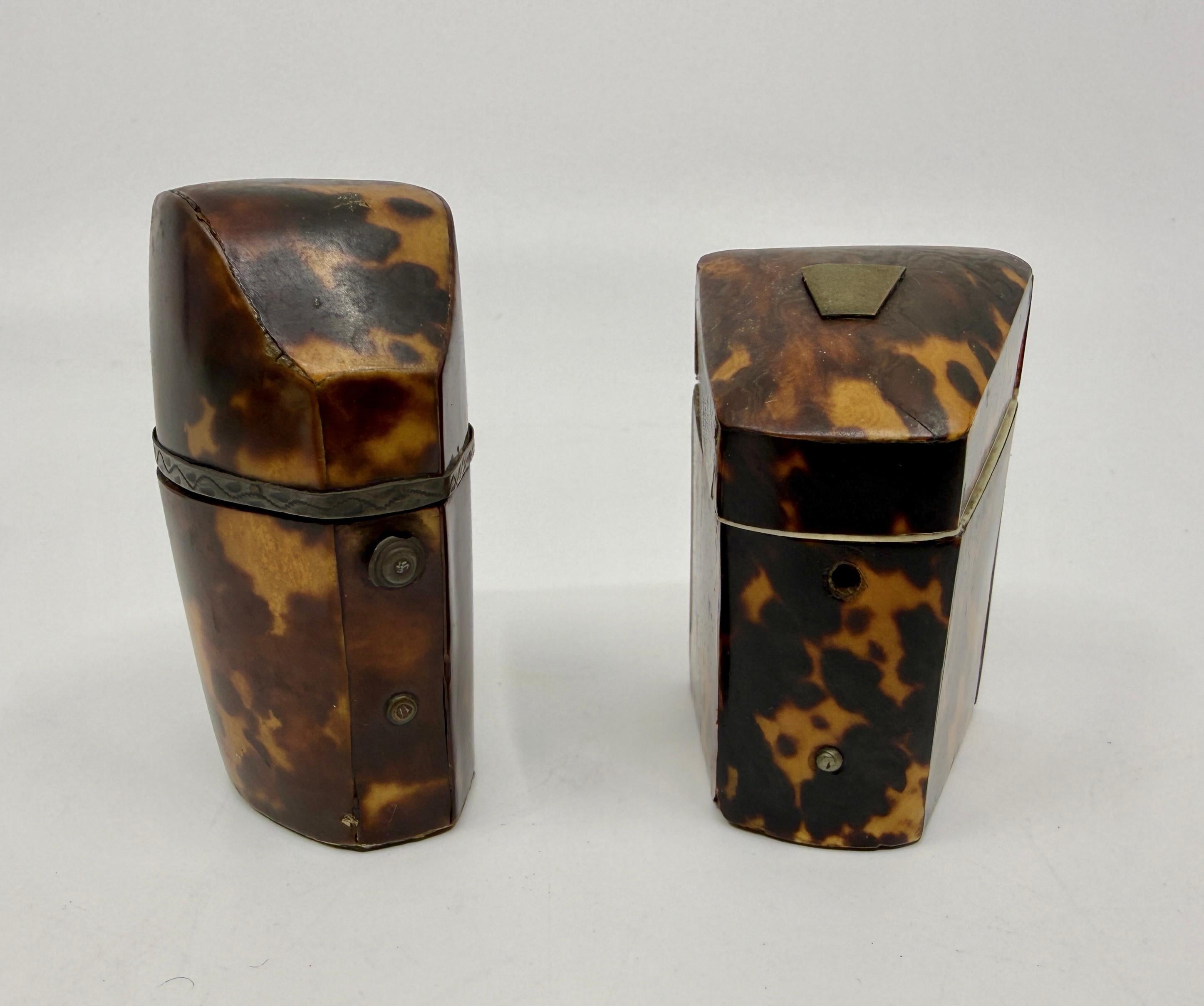 A lovely pair of Victorian horn perfume travel containers descended through a prominent New England Family. These two have pretty graining and are in generally good condition. The first still has its original glass container. The glass has a few