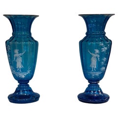 Pair of Victorian Light Blue Bohemian "Mary Gregory" Glassware Vases