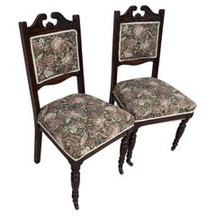 Pair of Victorian Parlor chairs with casters on front legs