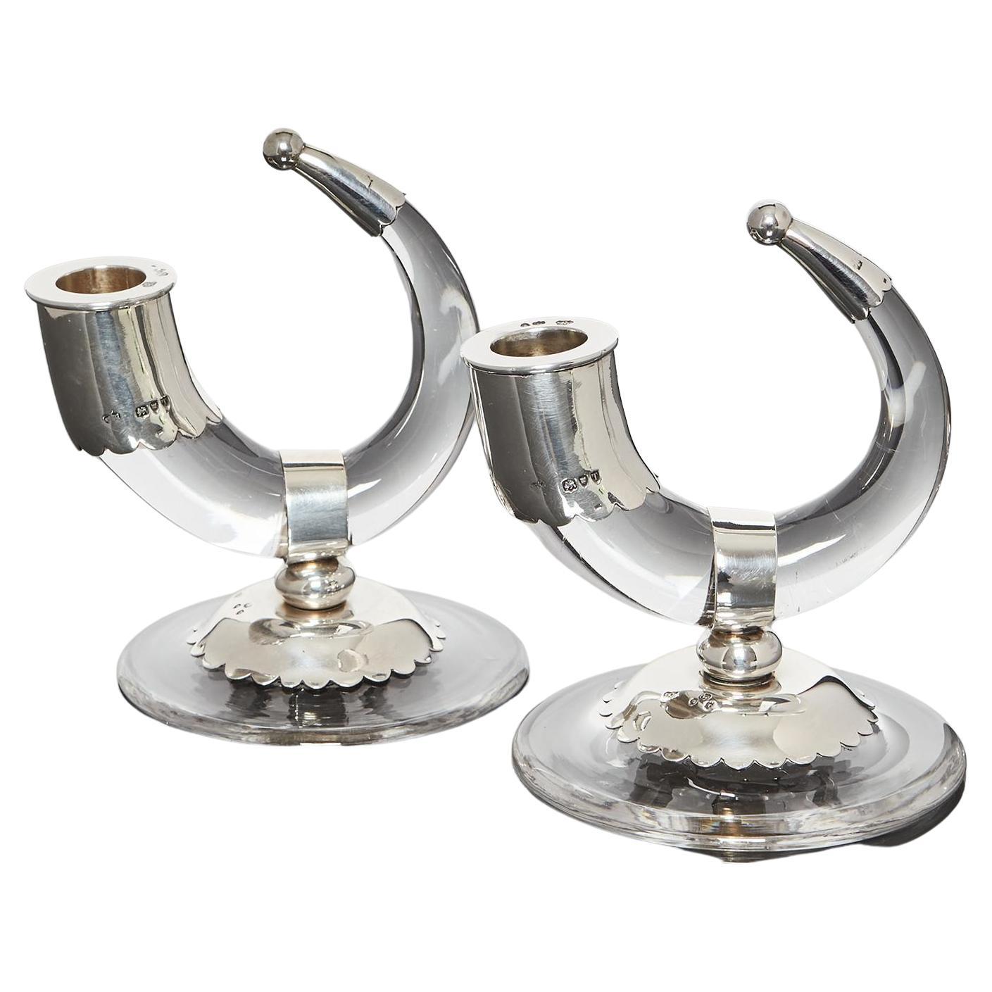 A most unusual and decorative pair of antique horn-shaped glass candlesticks fitted with hallmarked sterling silver mounts. The nozzles remove for easy cleaning.